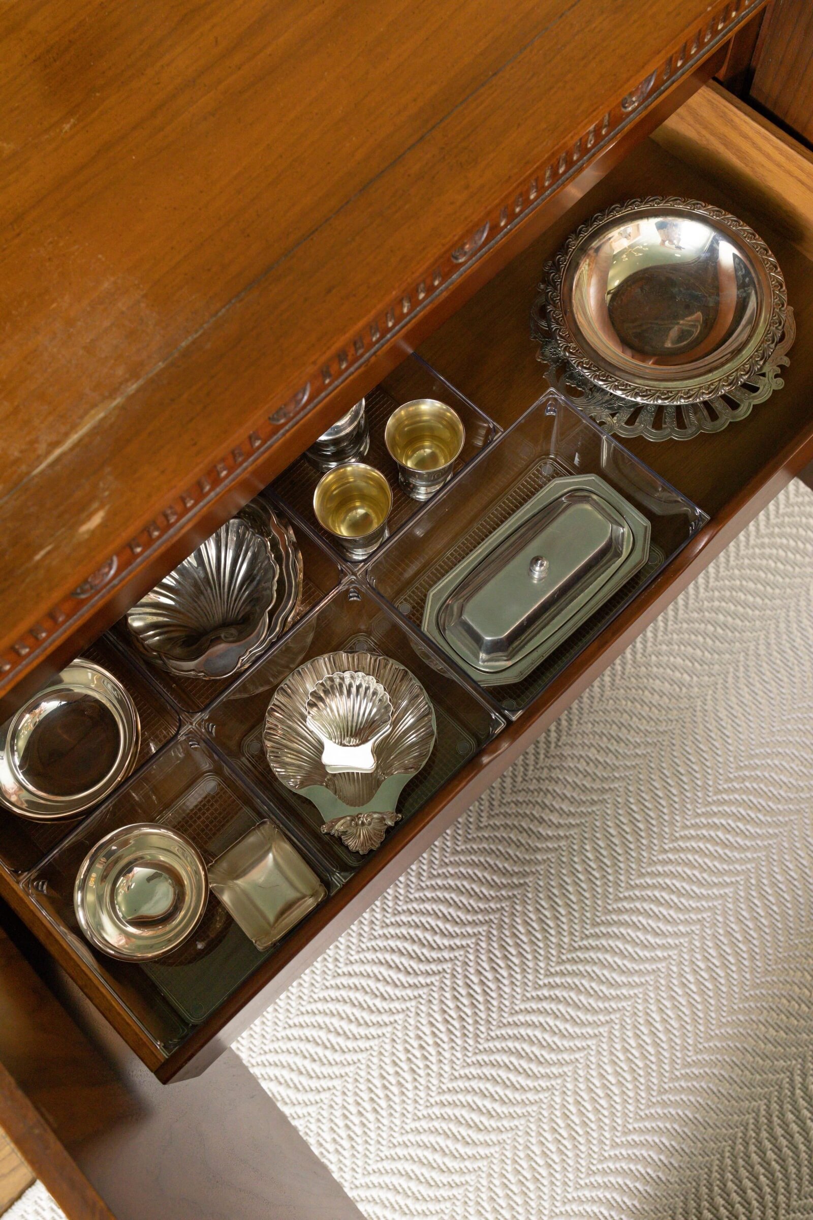 vision and hammer silver bowls in wooden cabinet