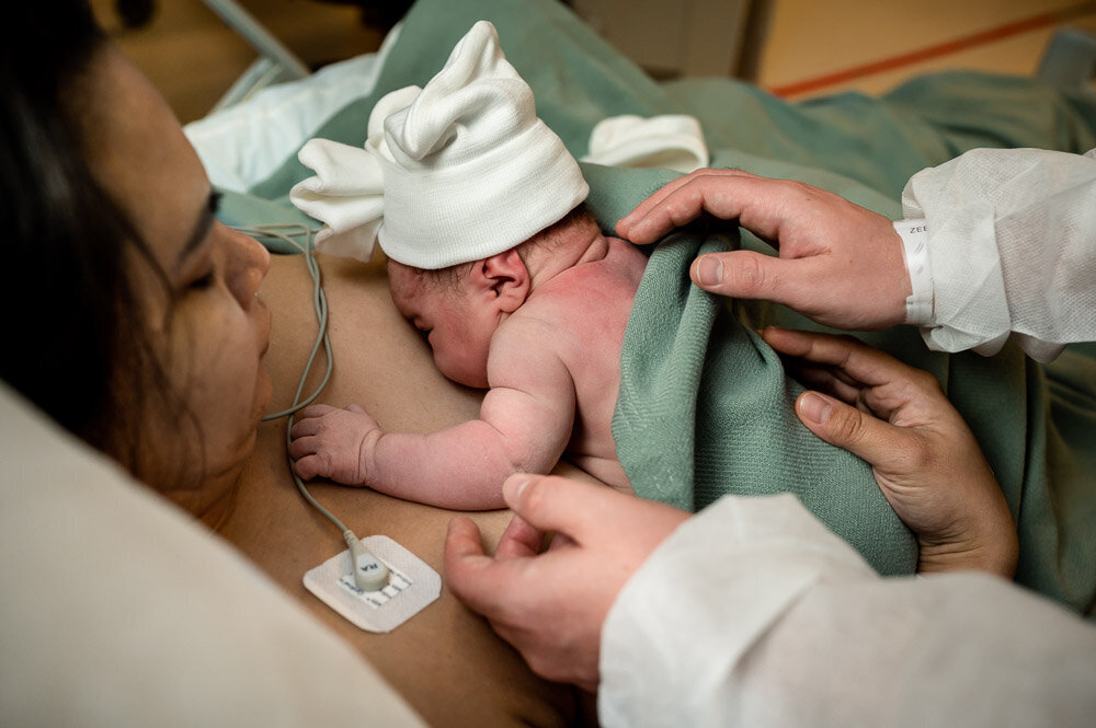 gentle hands with newborn after cesarean