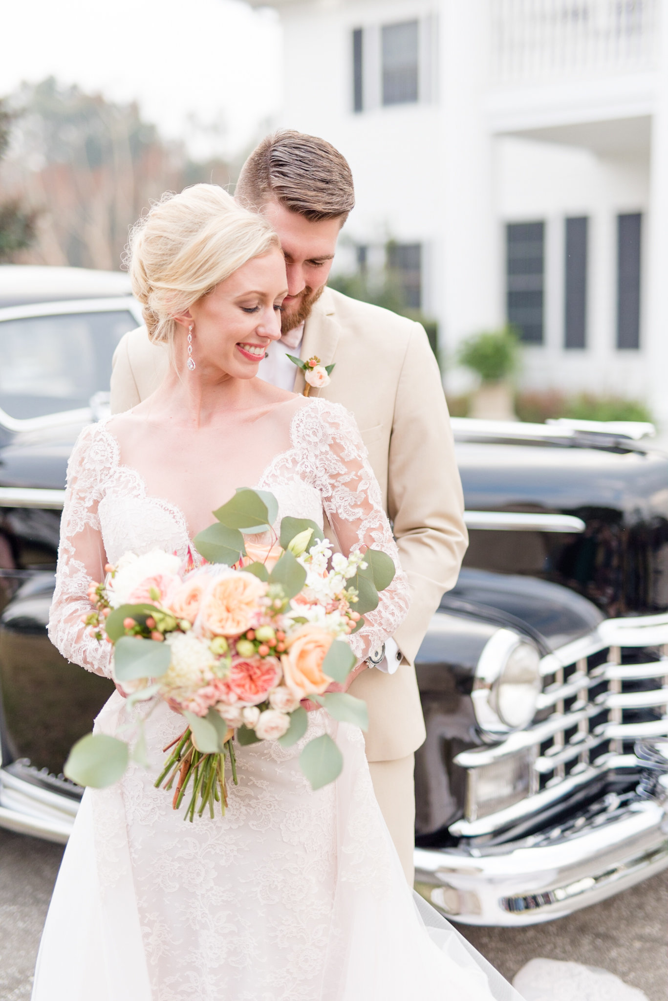 Birmingham Alabama Wedding Photographer Bride and groom stand next to vintage car.