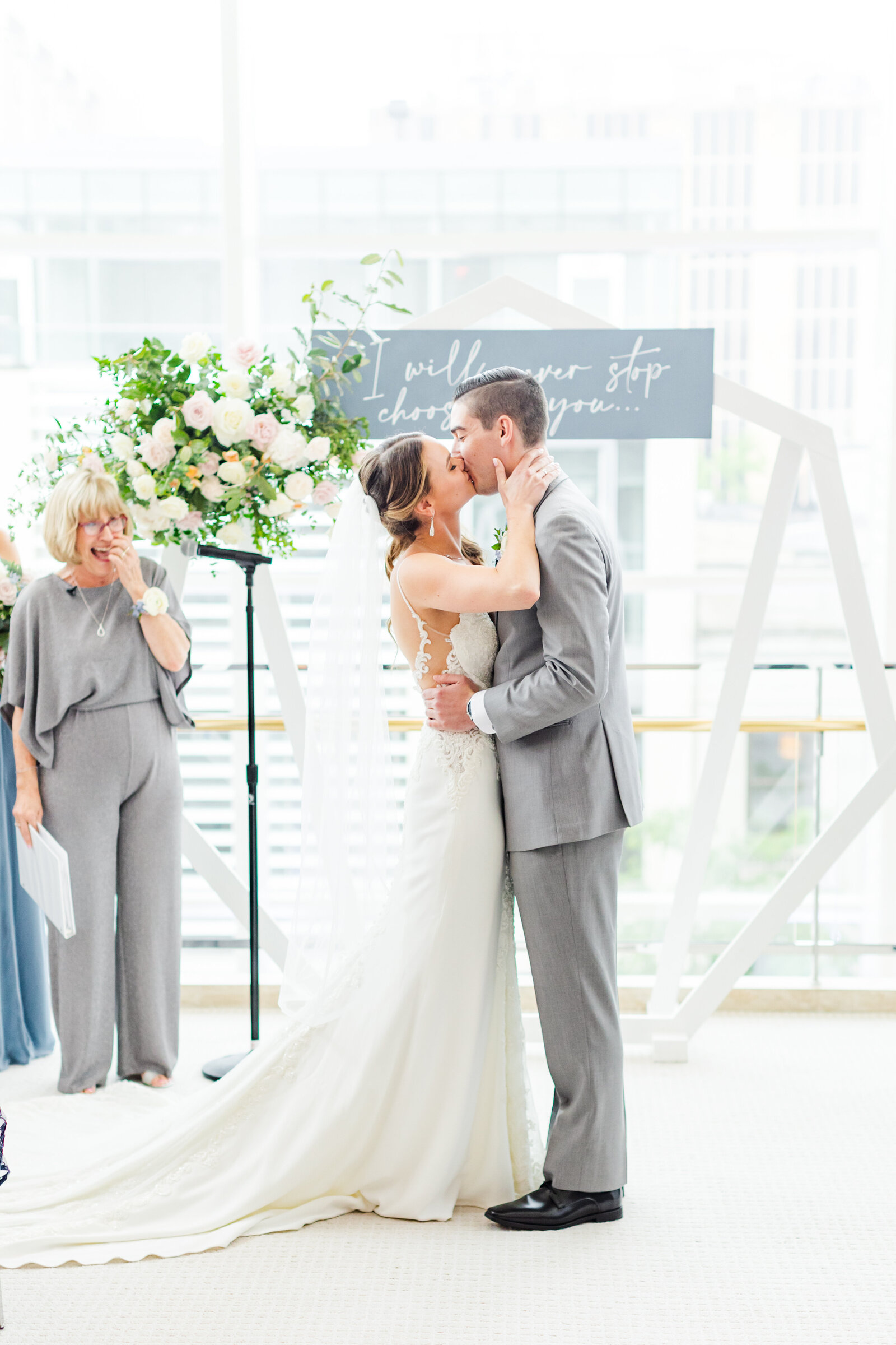 65_bride_and_groom_kissing_after_ceremony