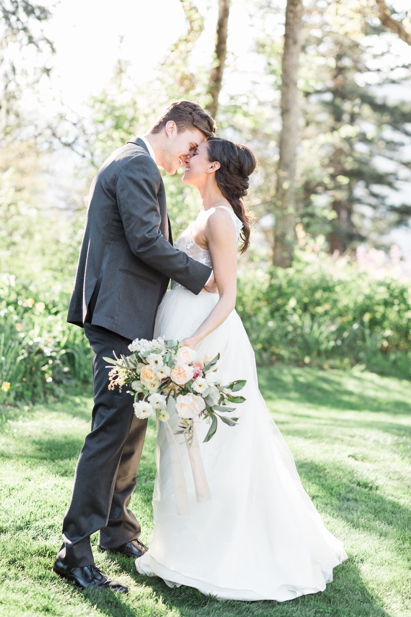 Bride and groom happily embrace at the Columbia Gorge Hotel in Oregon