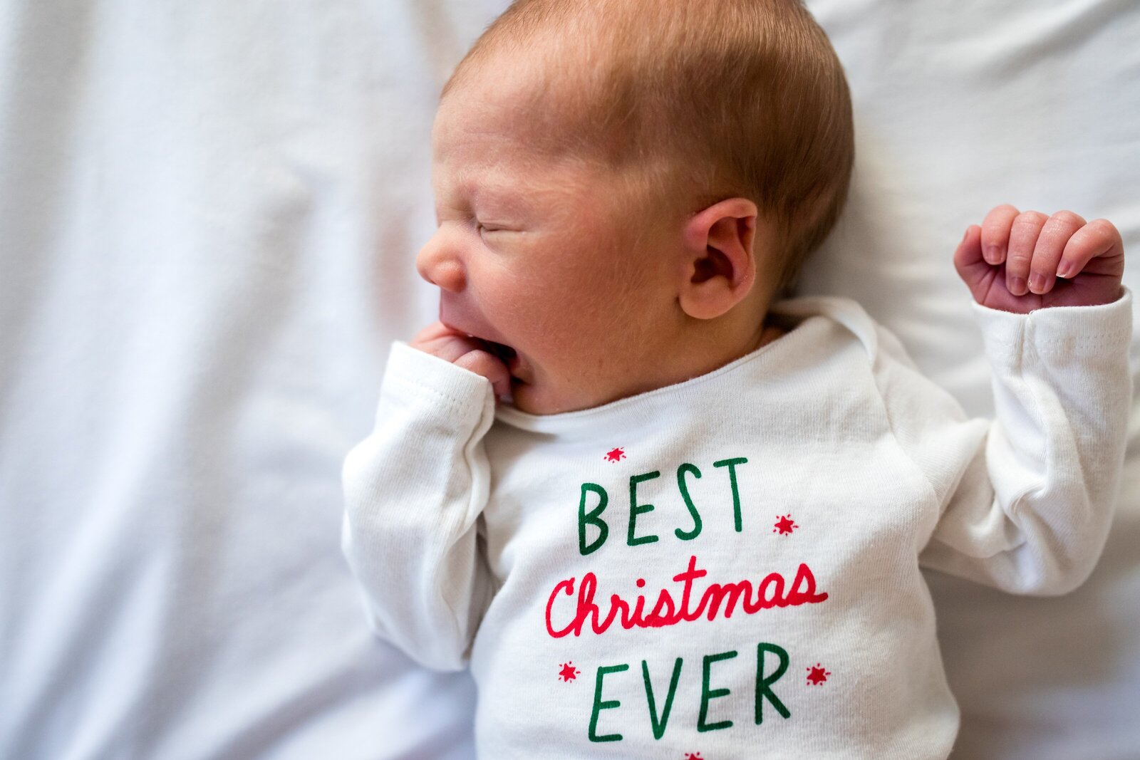 Newborn baby wearing best christmas ever outfit