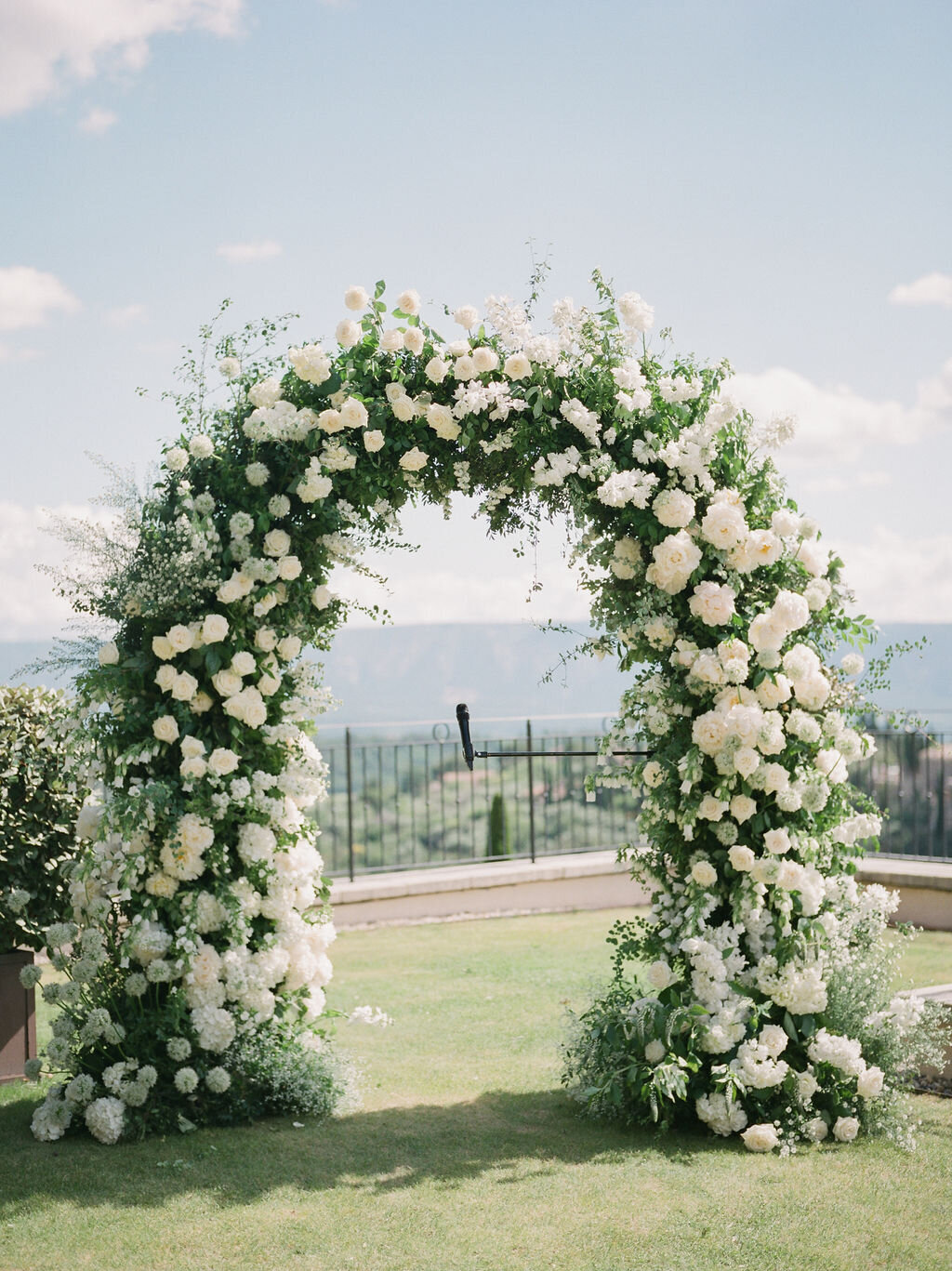 White floral arch ceremony