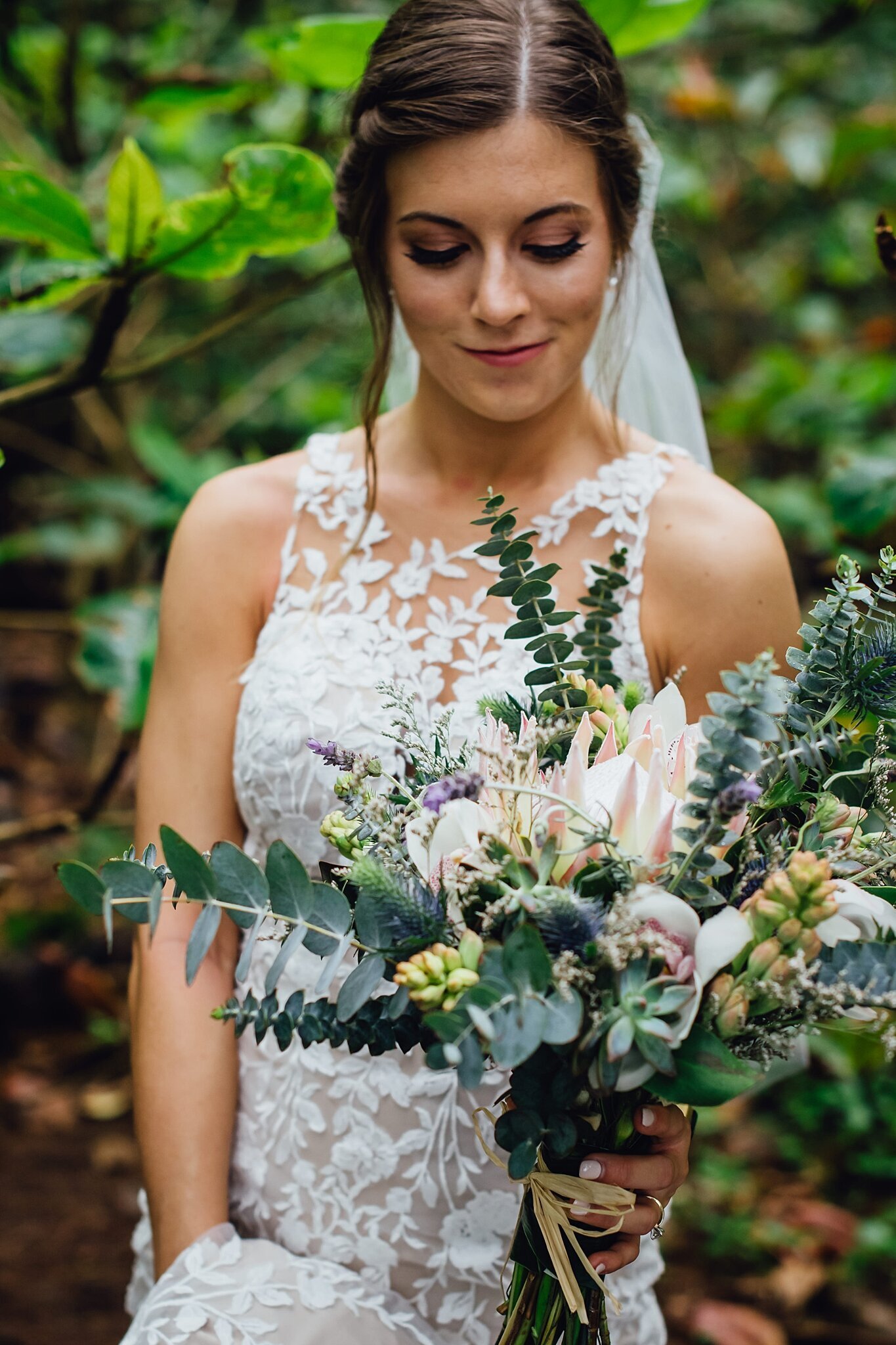 bride with gorgeous succulent wedding florals