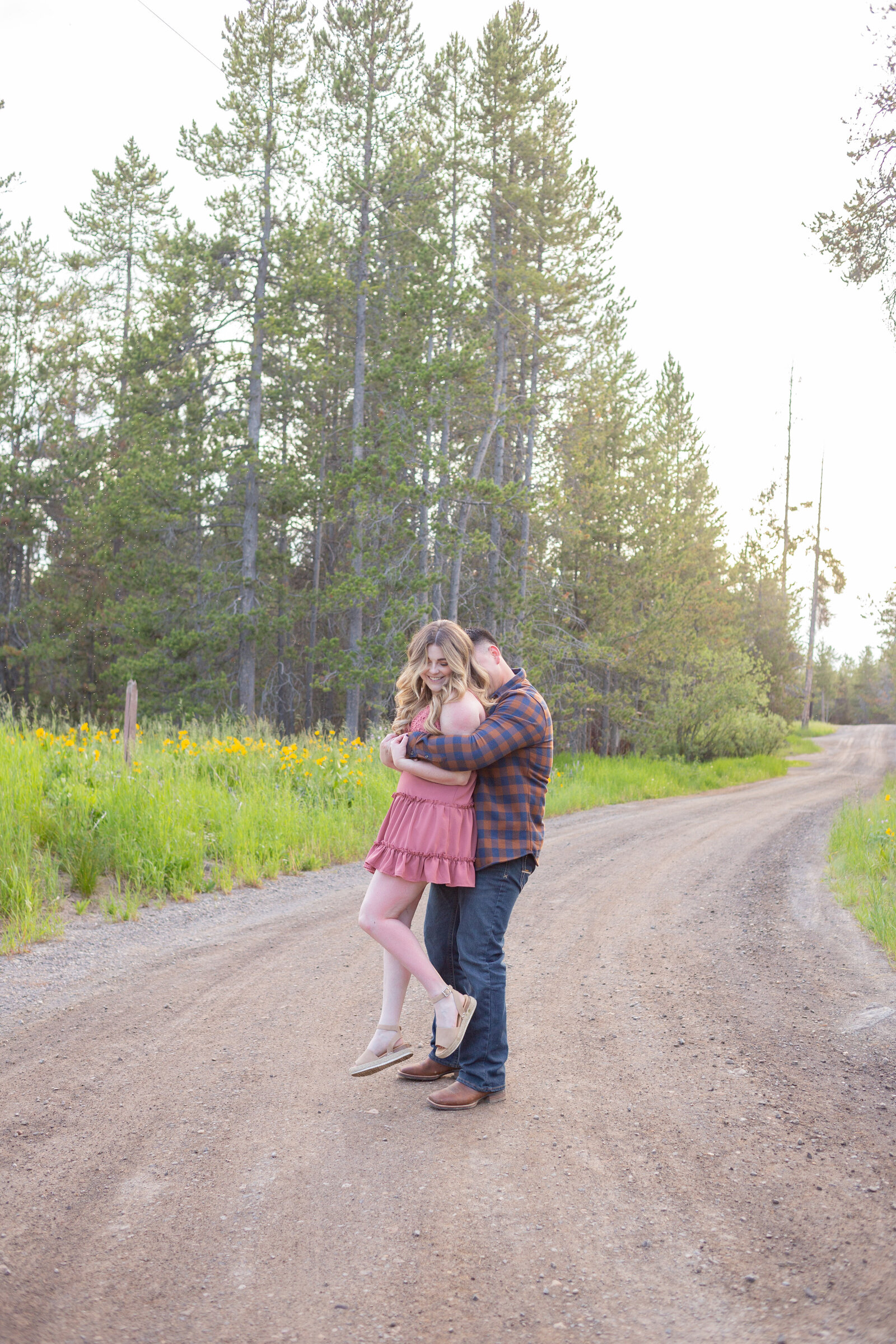 Washington Elopement Photographer captures man lifting woman during engagements
