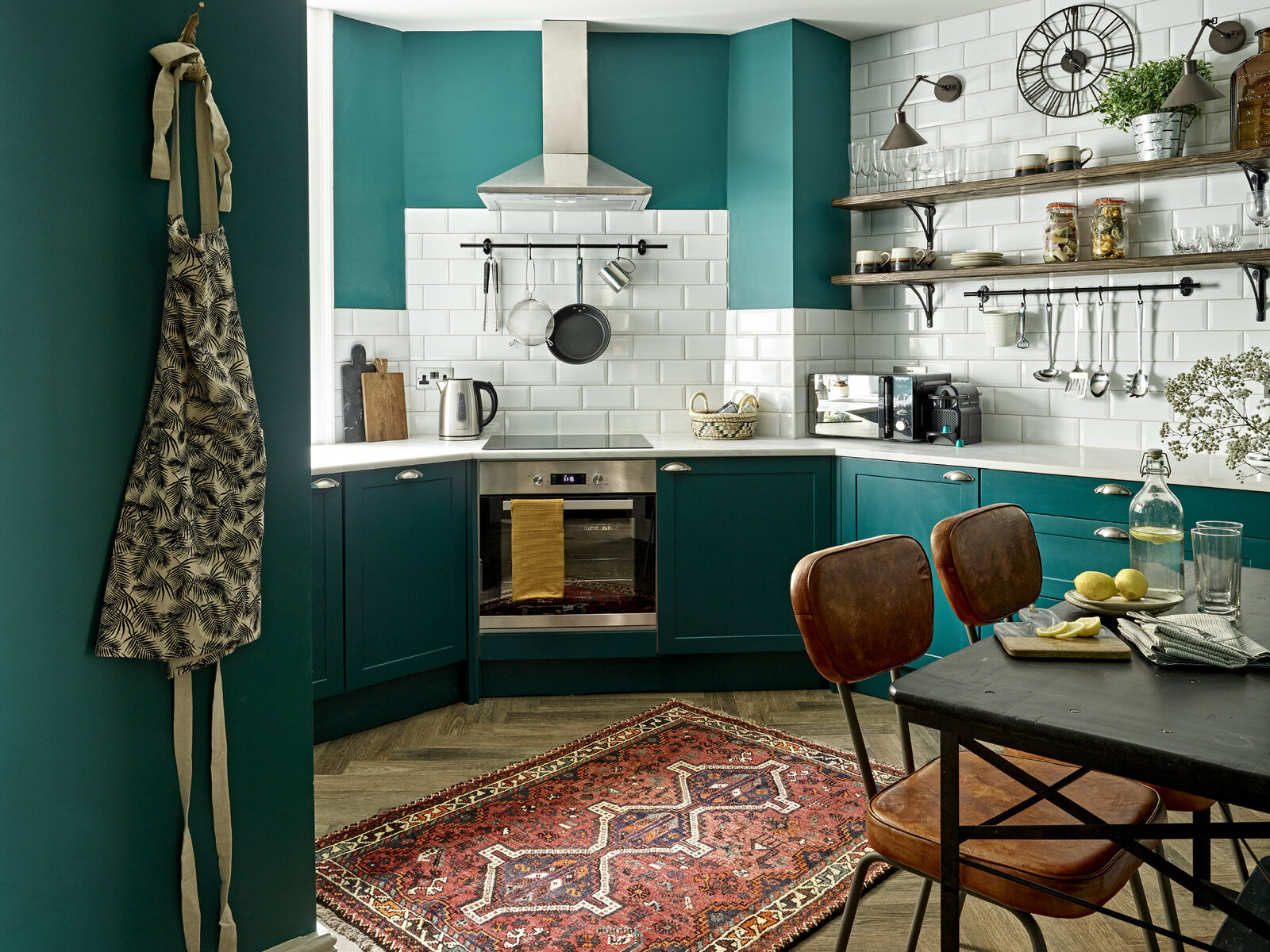 Teal and peacock kitchen wall and cabinet color in modern apartment
