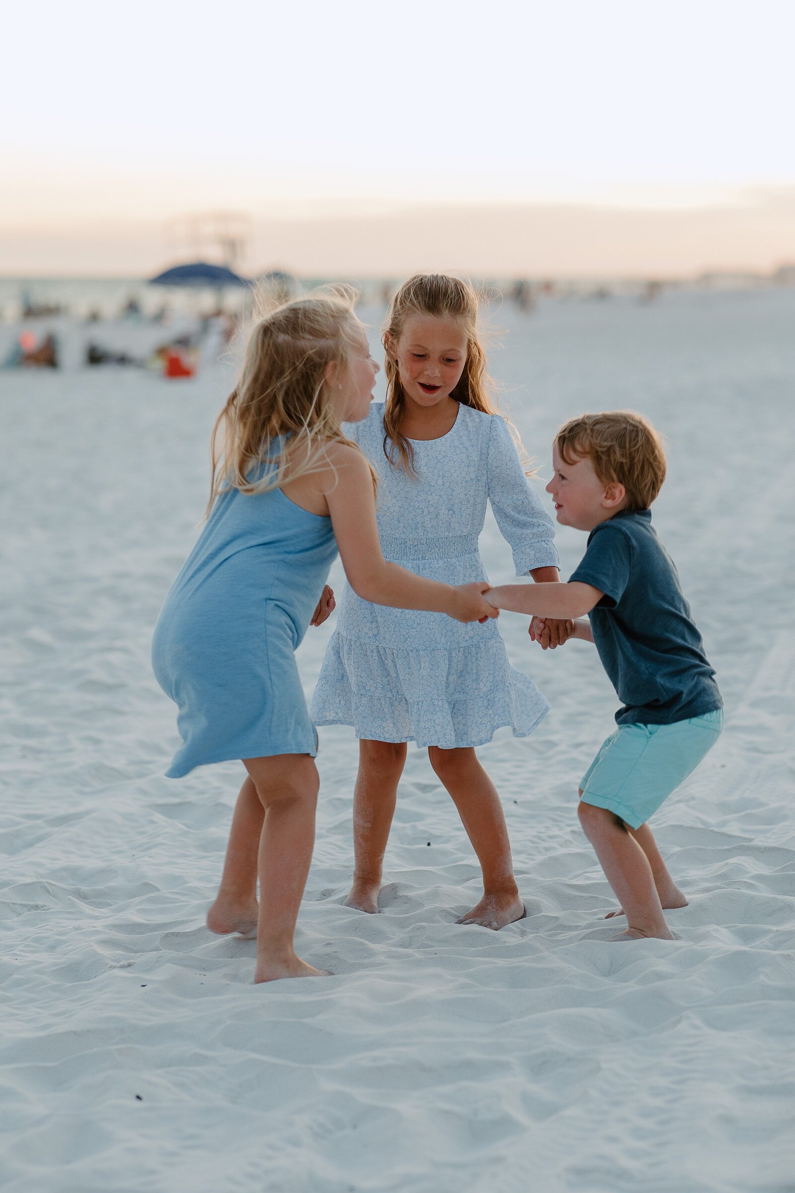 Pensacola Beach vacation family photography session .  Kids playing on the beach.