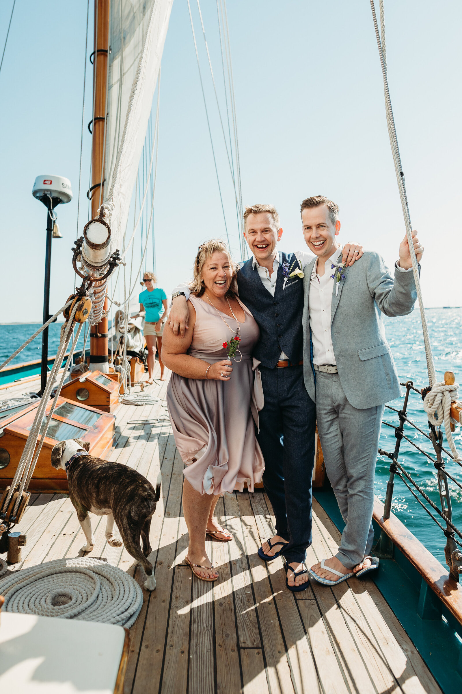 couple stands on yacht after getting married