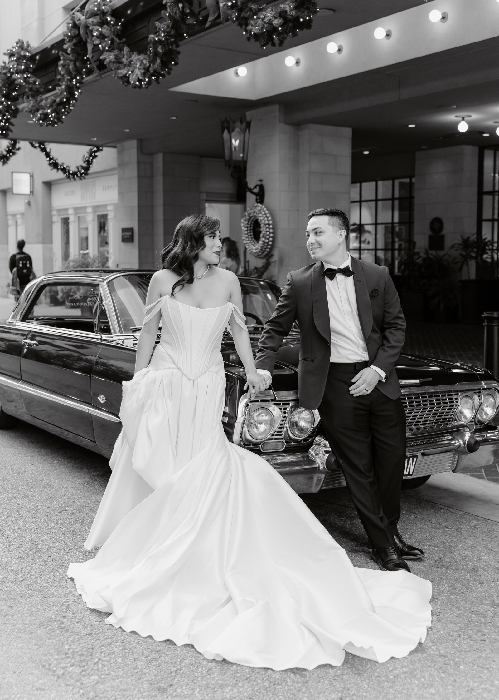 The bride and groom wanted editorial photographs of them infront of their venue on their getaway car.