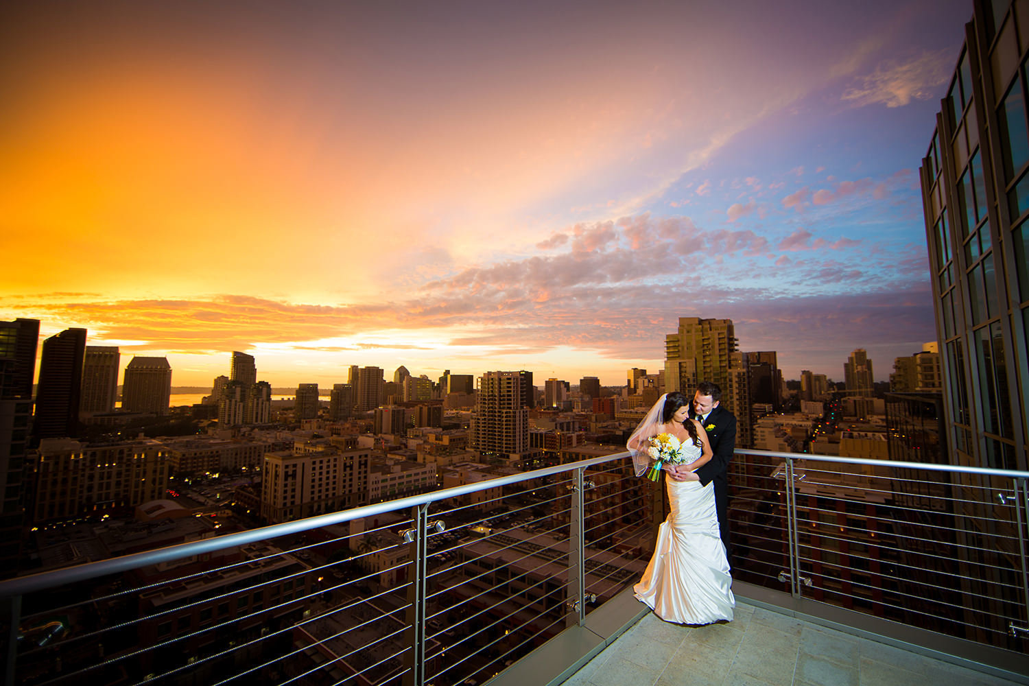 Romantic portrait with surreal sunset over the downtown San Diego skyline.