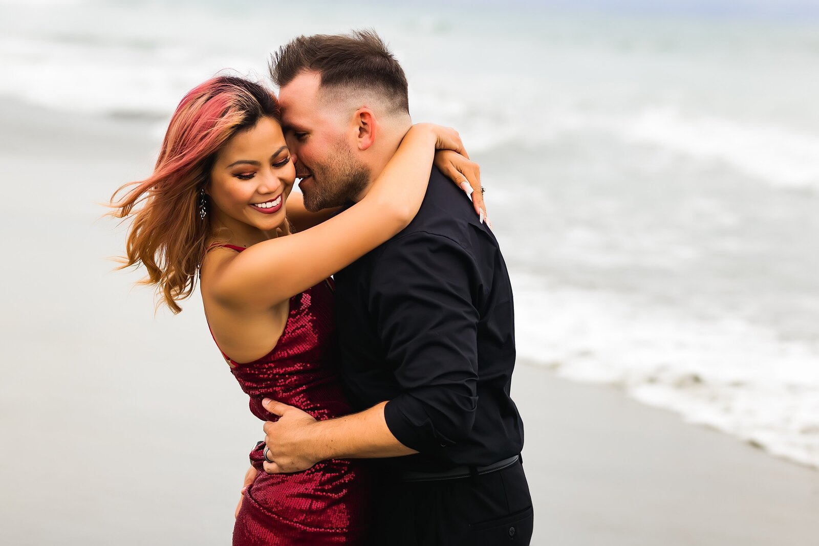 Couple flirting on the beach in San Diego