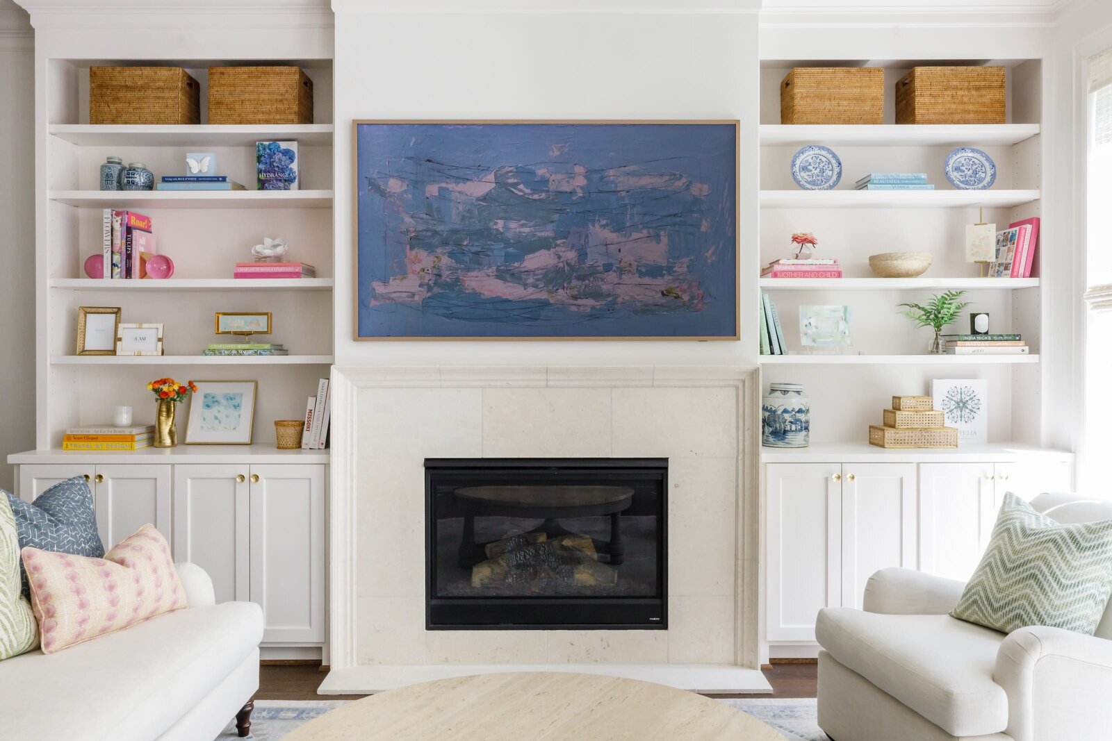 vision and hammer styling shelf on each side of a fireplace and large picture frame