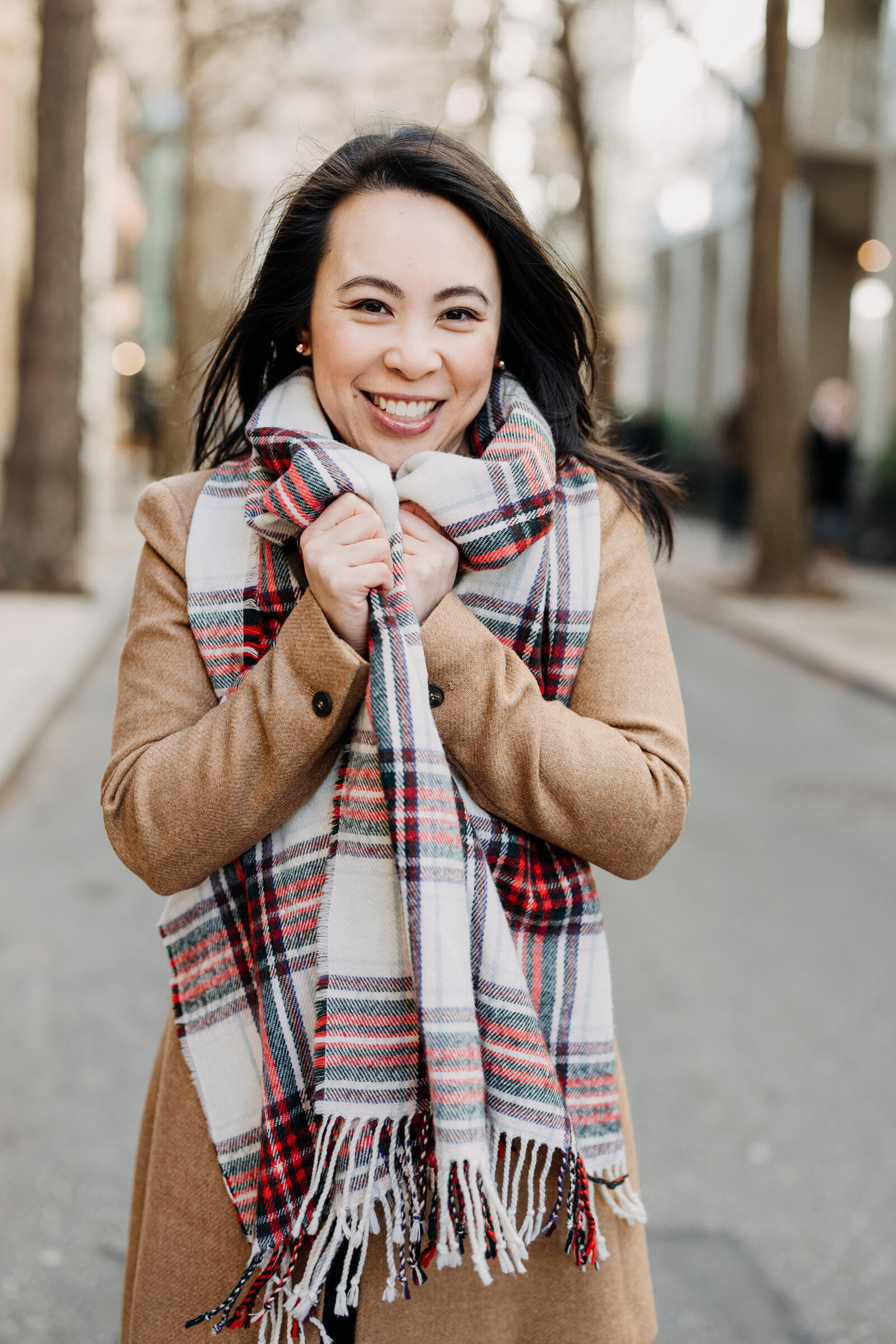 asian woman with scarf in the city