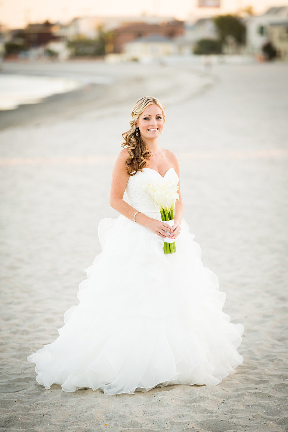 bride and beach with white flowers