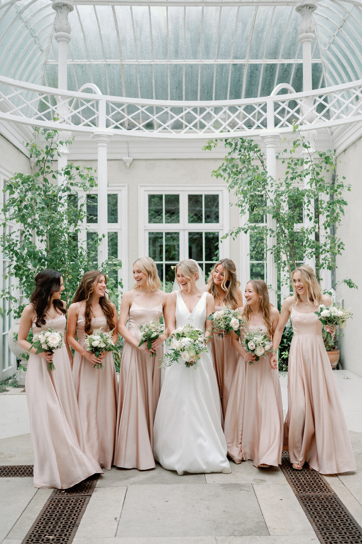 Bride and Bridesmaids at domed conservatory
