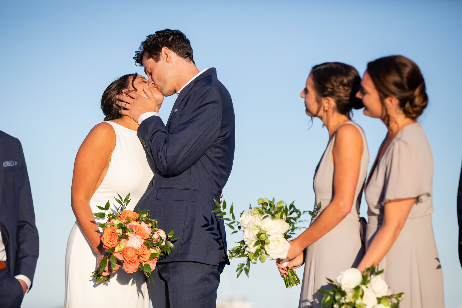 bride and groom kiss at scituate yacht club ceremony