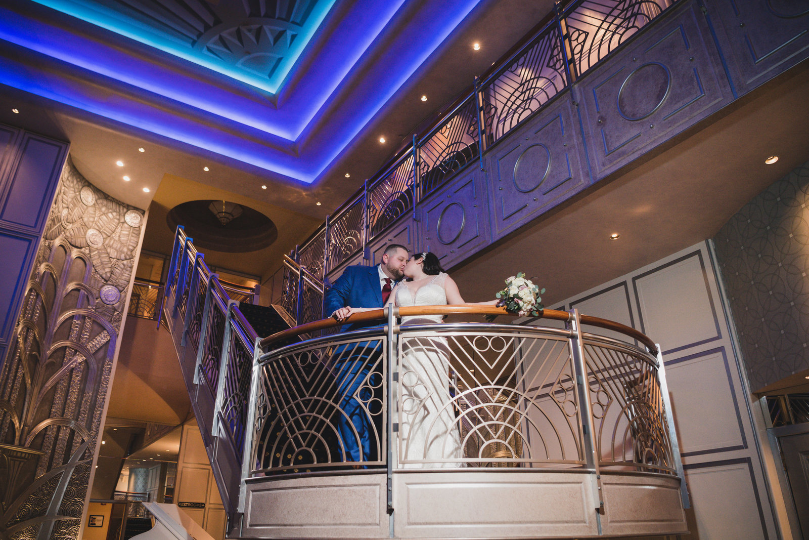 bride and groom kissing on stairs at Chateau Briand