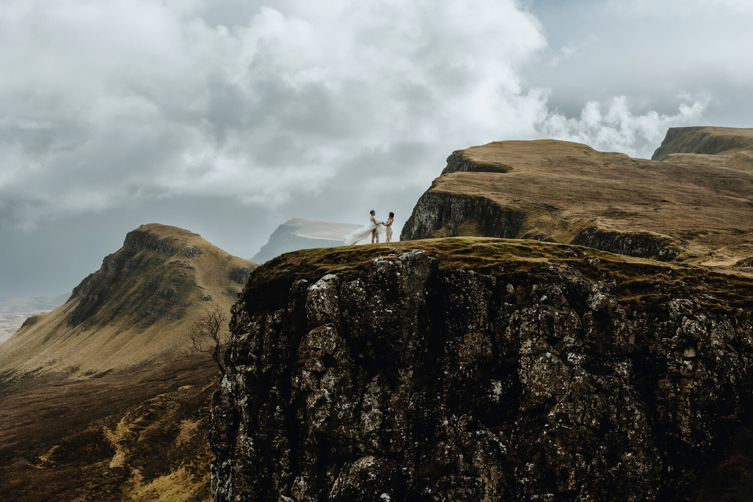 Young couple is exchanging their vows in Iceland in front of a waterfall