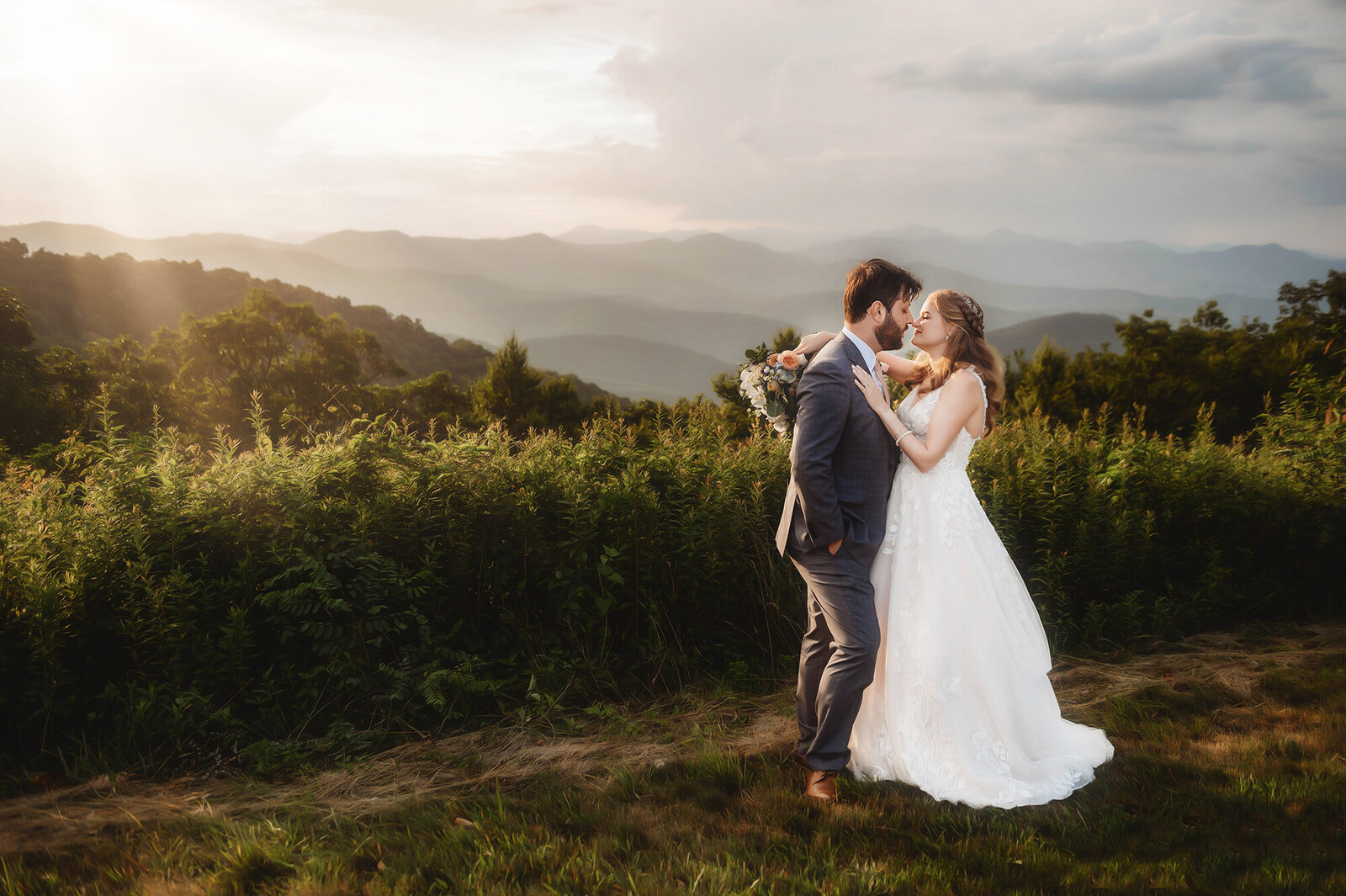 Bride and Groom kiss during their Elopement on the Blue Ridge Parkway in Asheville, NC.