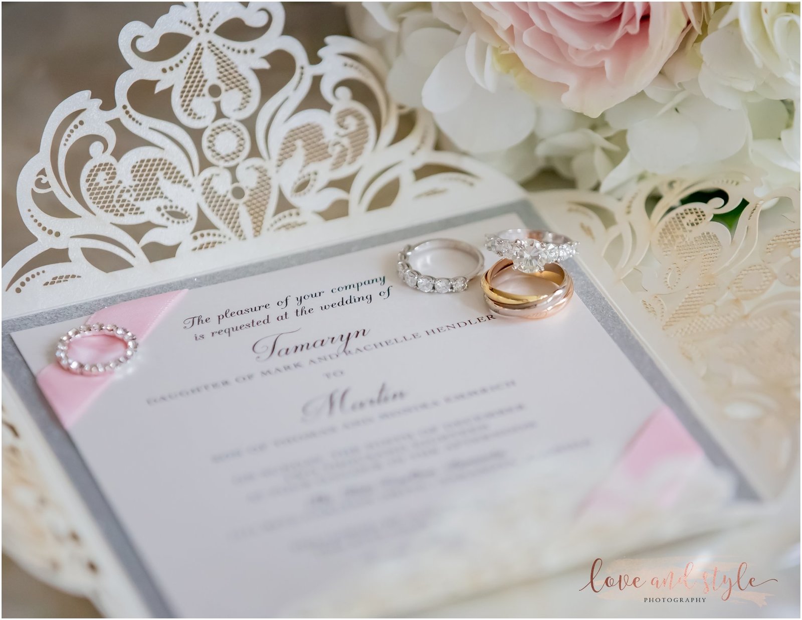 Detail shot of wedding rings and invitation suite for a wedding at The Ritz Carlton, Sarasota
