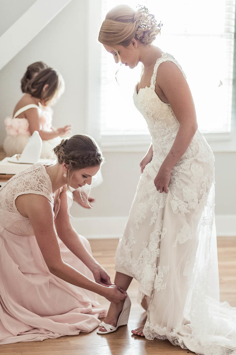 Bride gets into dress, Alhambra Hall, Mt Pleasant, South Carolina