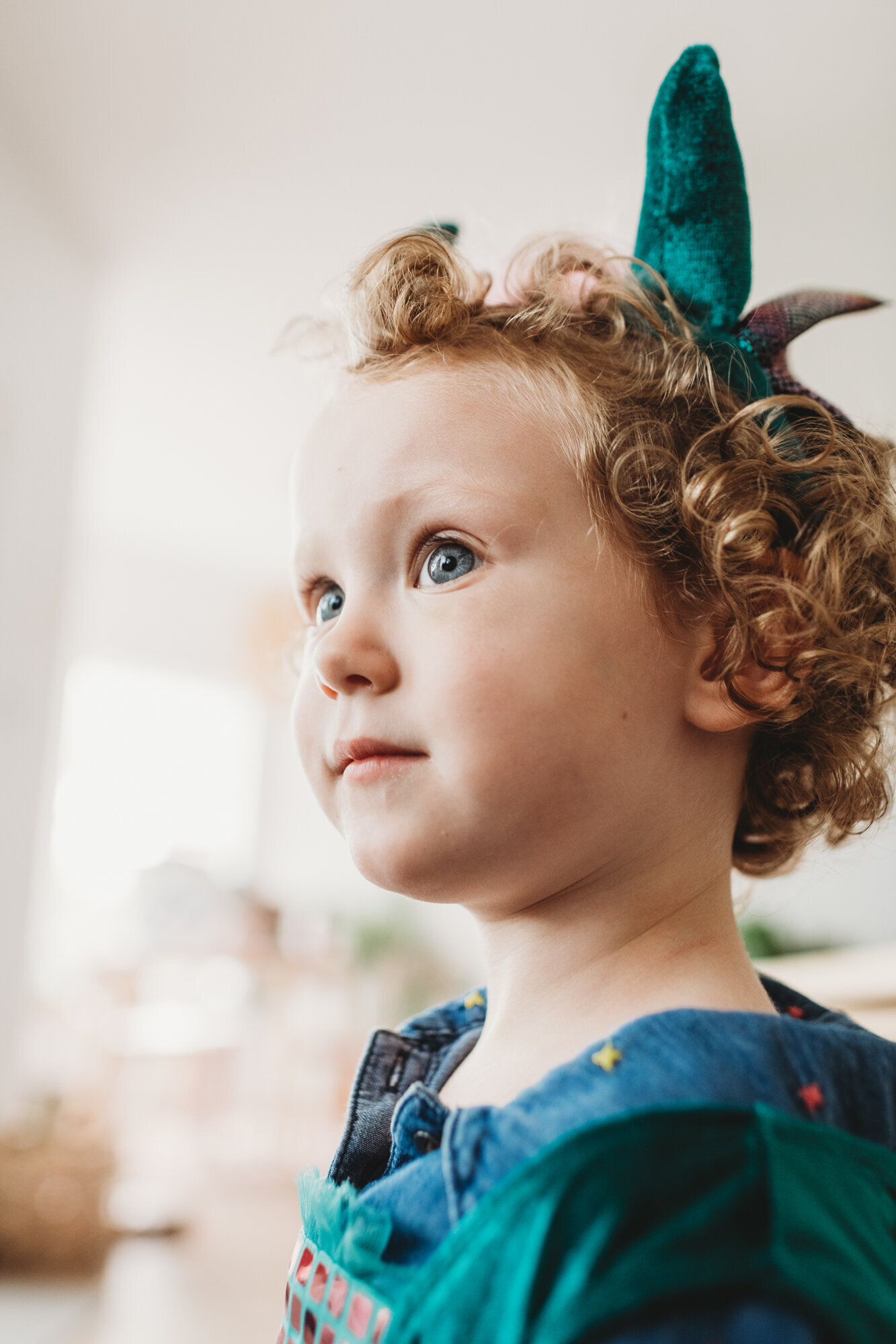 Branding Photographer, a little girl wears a head band and velvet overalls