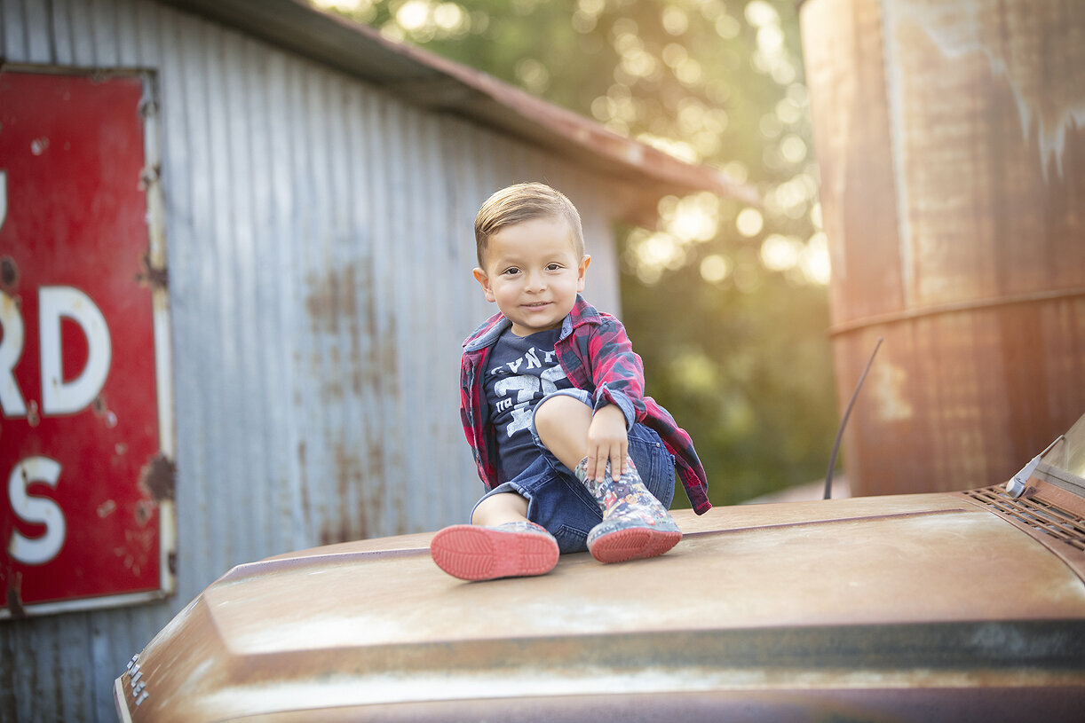 Boy on top of vintage pick up, photo by Dahlias and Daisies Photography.