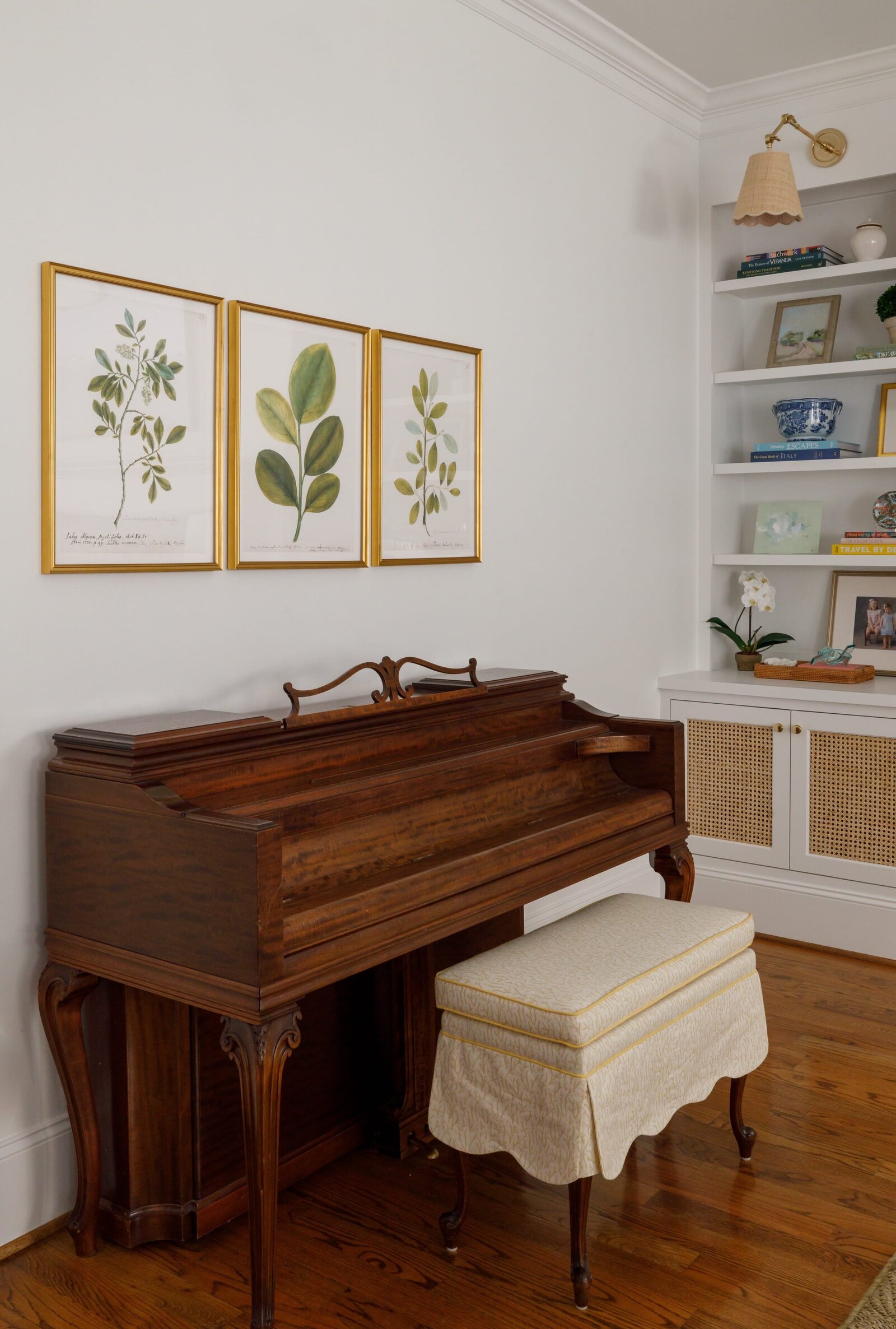 vision and hammer wooden piano with gold picture frames