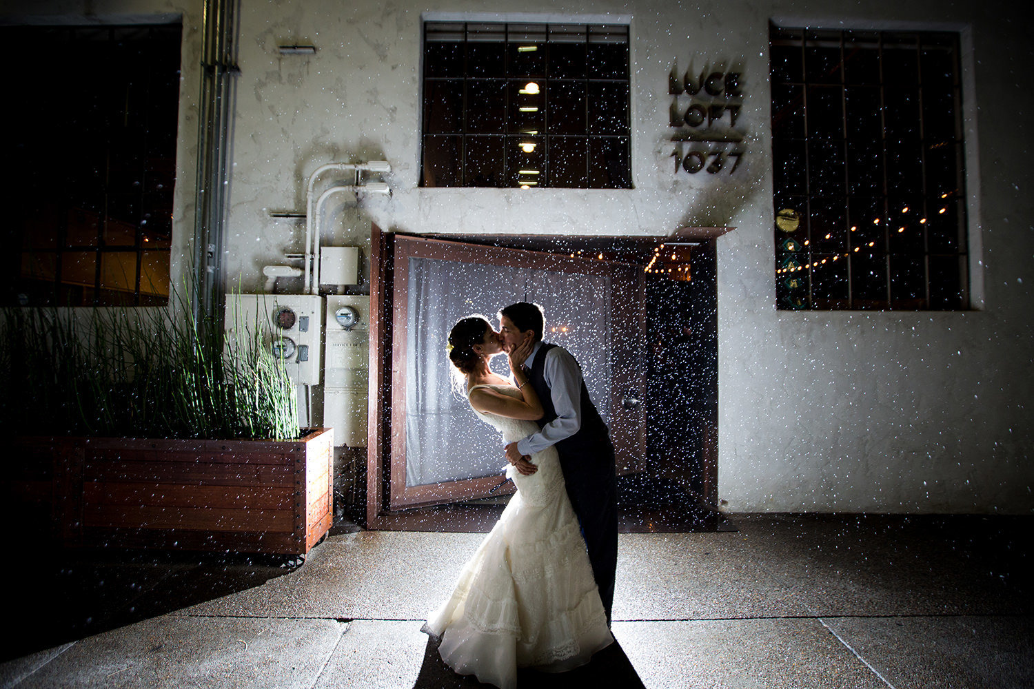 night image of bride and groom in front of luce loft