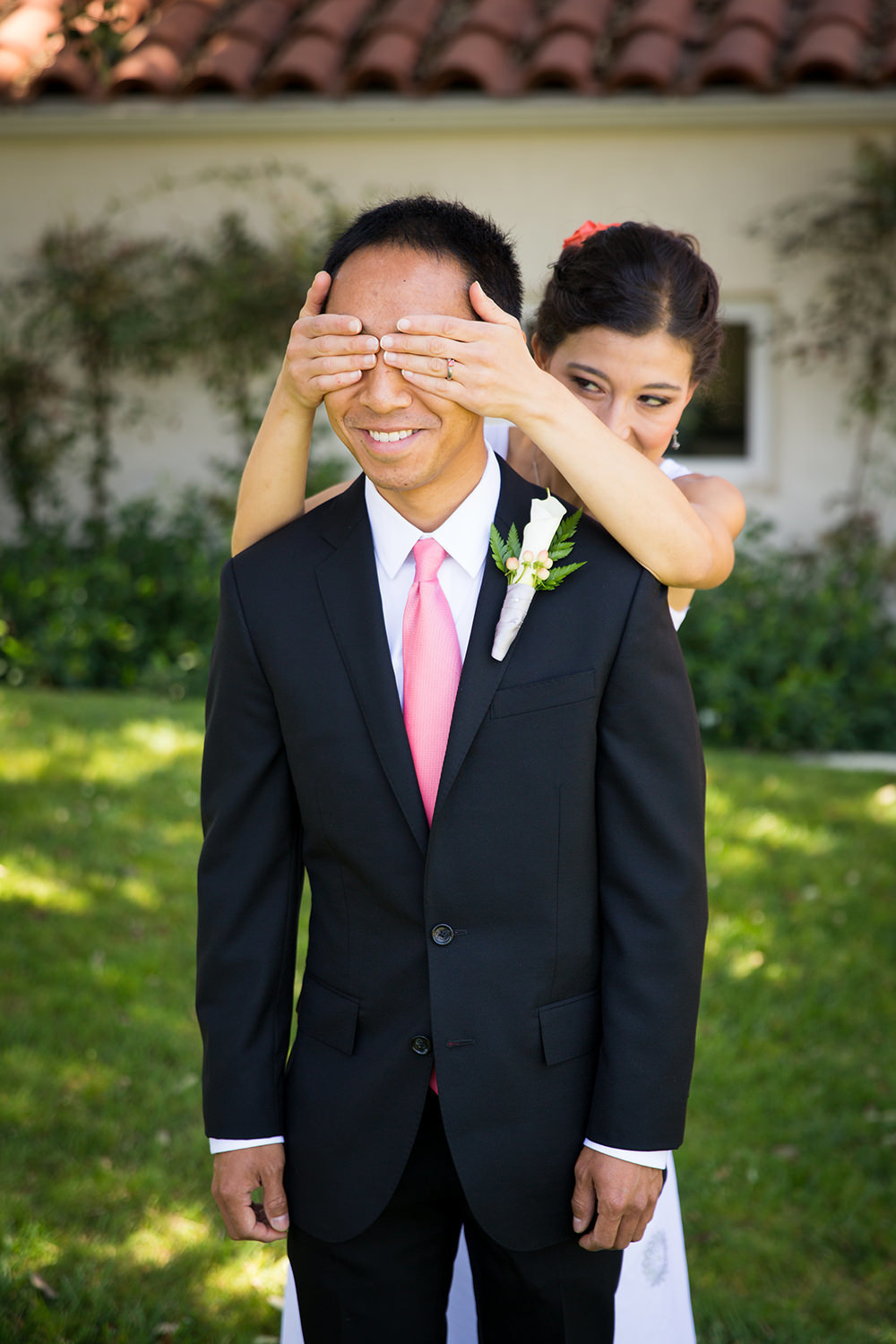 bride covering grooms eyes first look