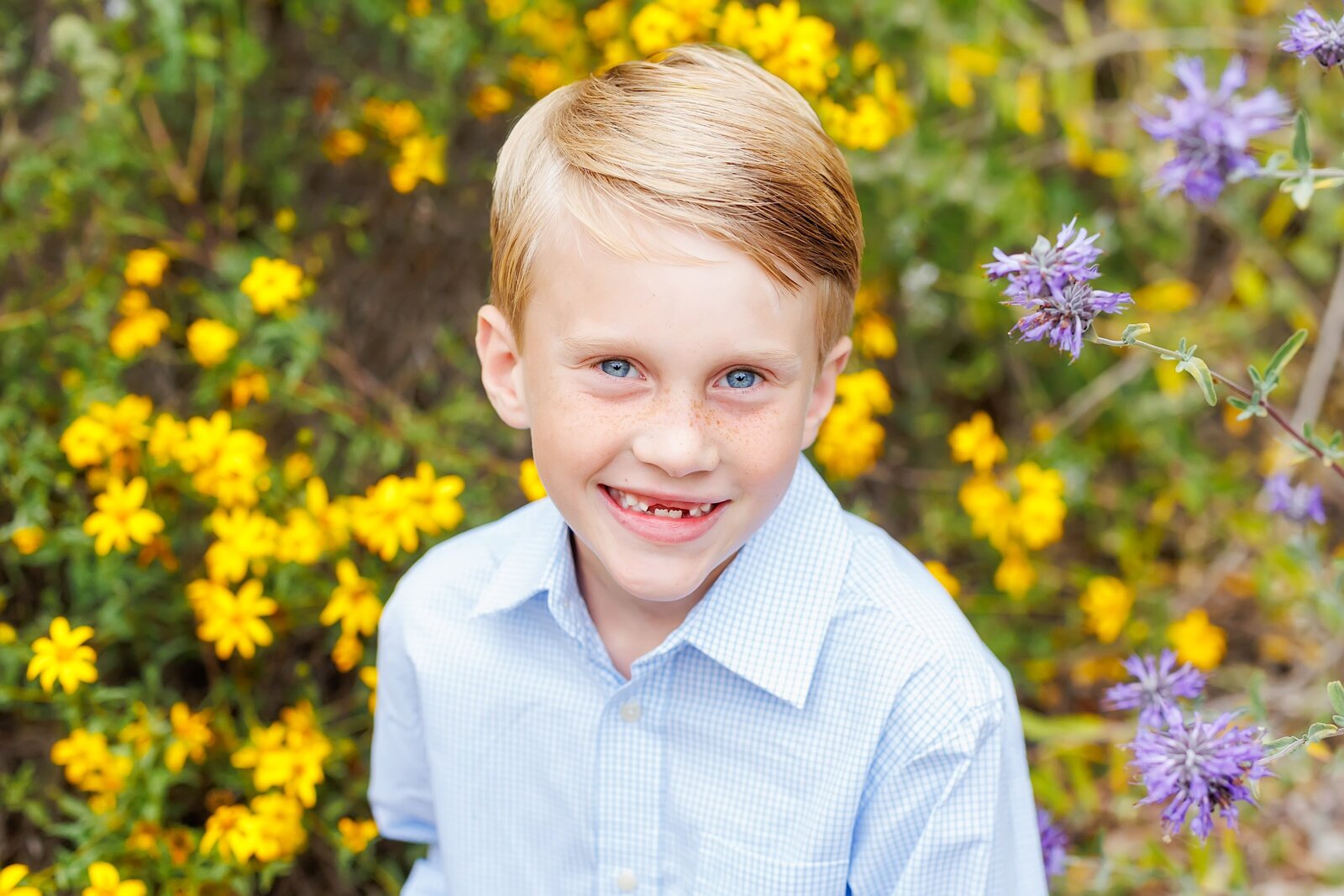 Young Boy smiling with flowers taken in north county San Diego