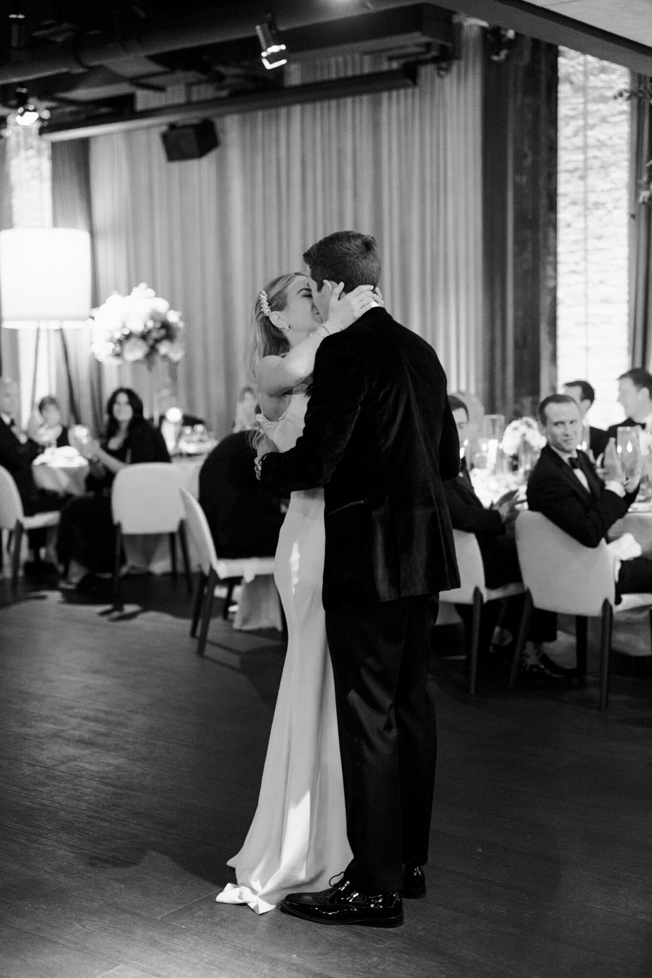 A black and white first dance photo at a wedding reception captured at the Dalcy in Chicago