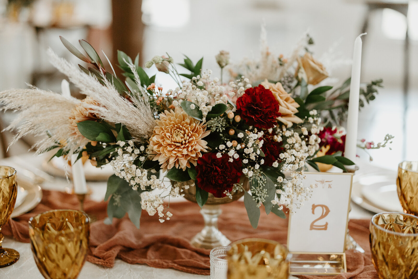 boho inspired floral centerpiece with pampas grass