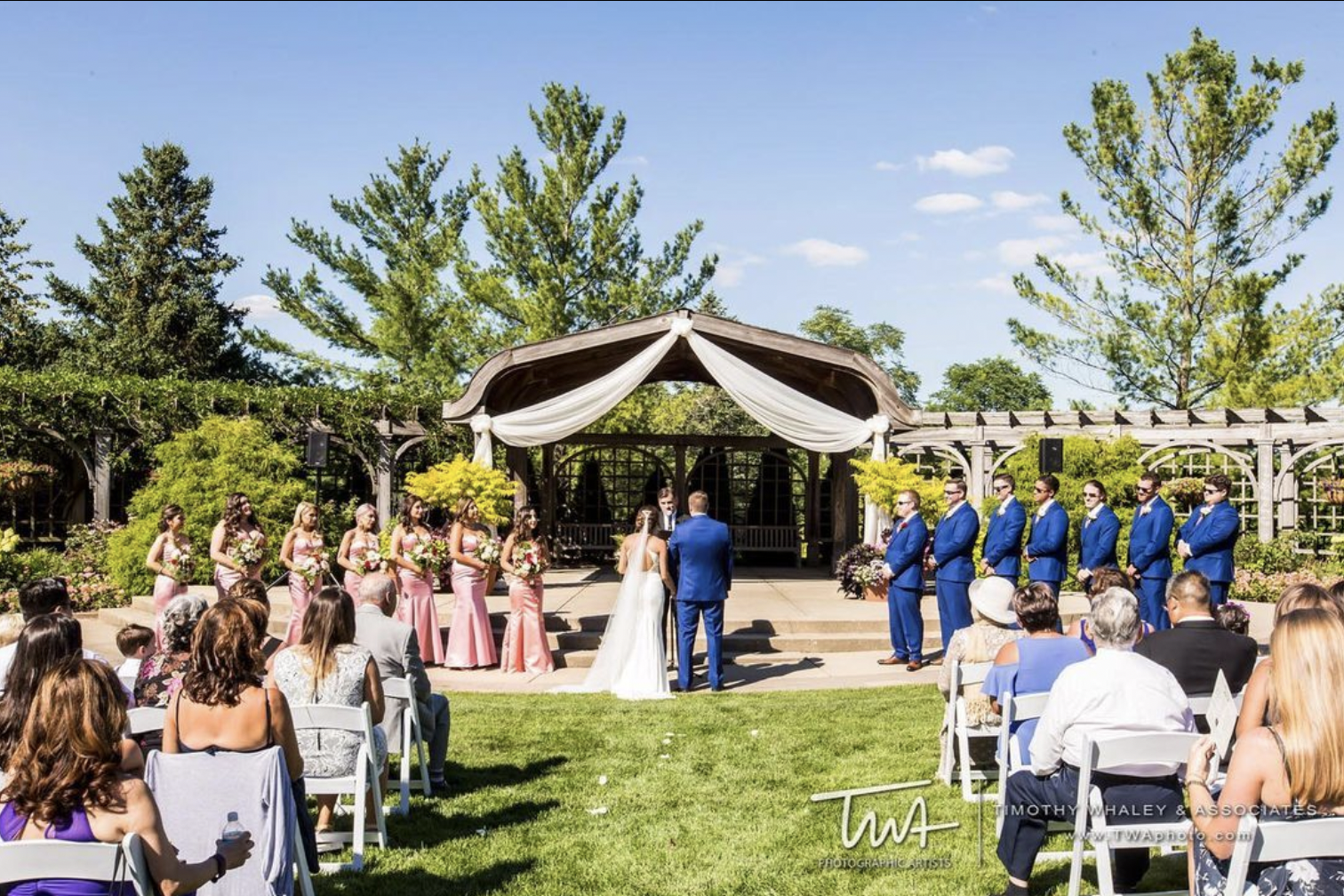Bride and groom take their vows at outdoor wedding