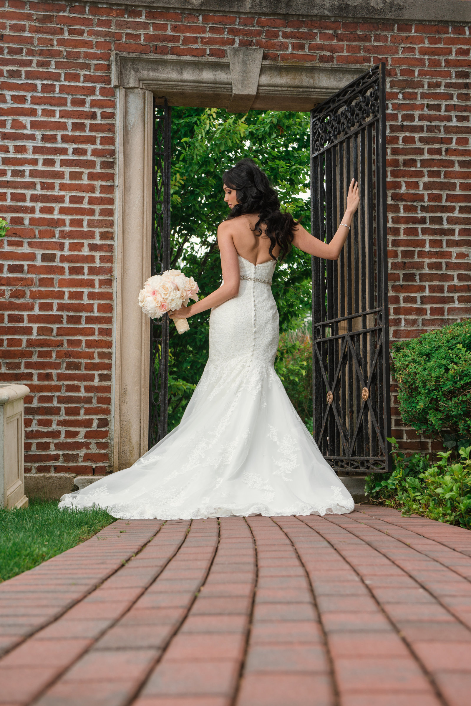 Bride at the gate at Glen Cove Mansion