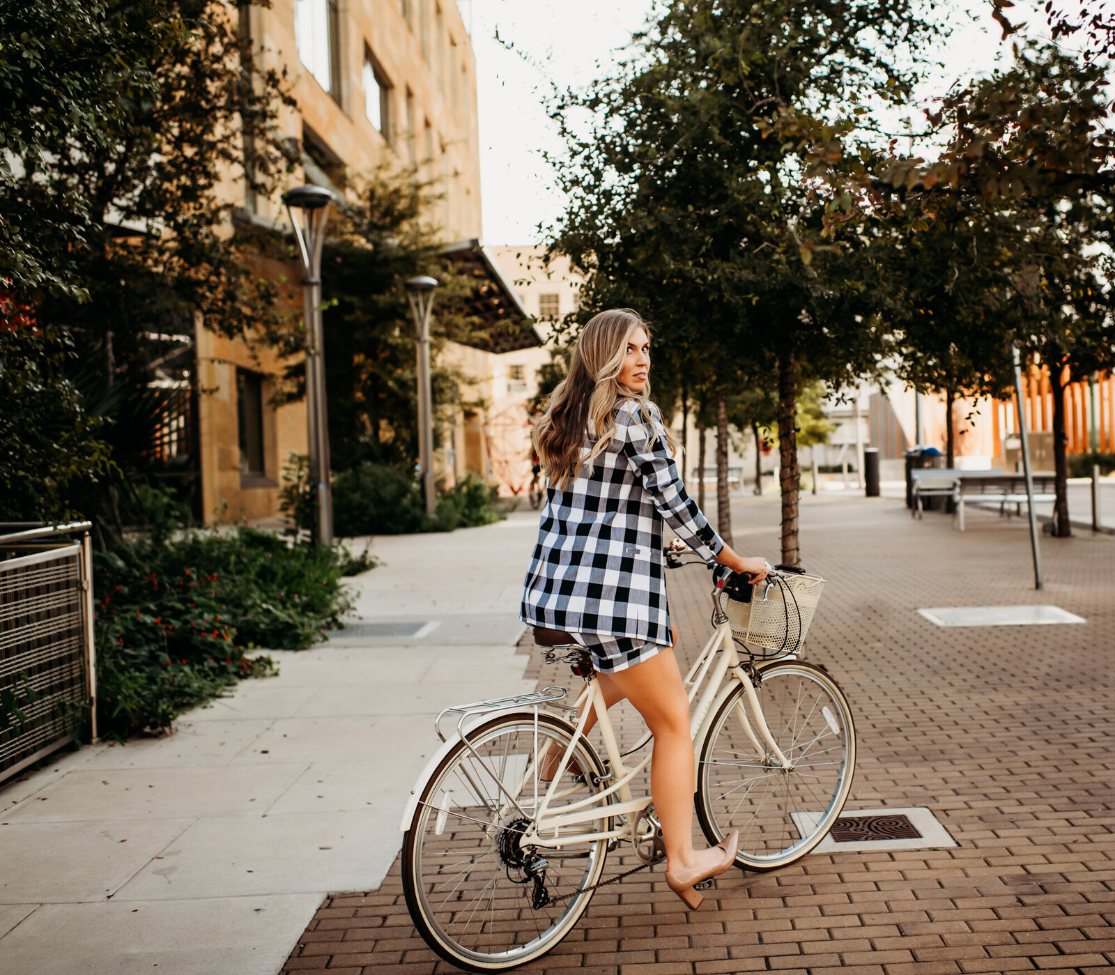 Branding Photographer, woman sits on bike in town