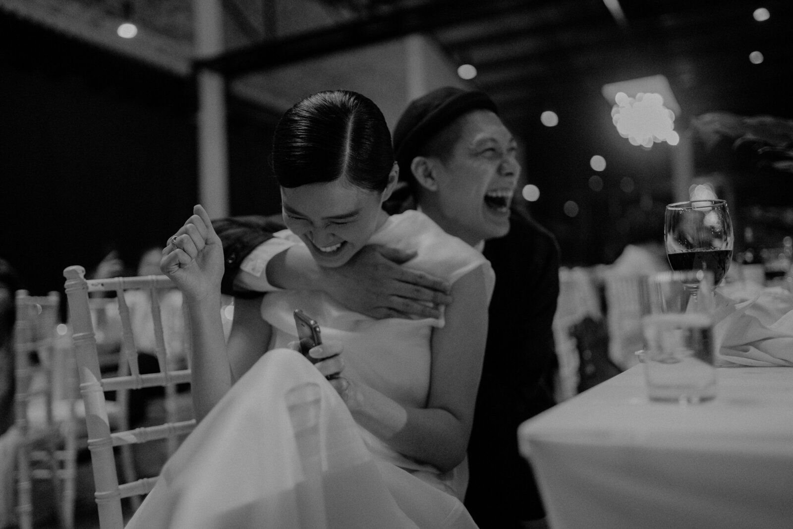 couple laugh on their wedding banquet