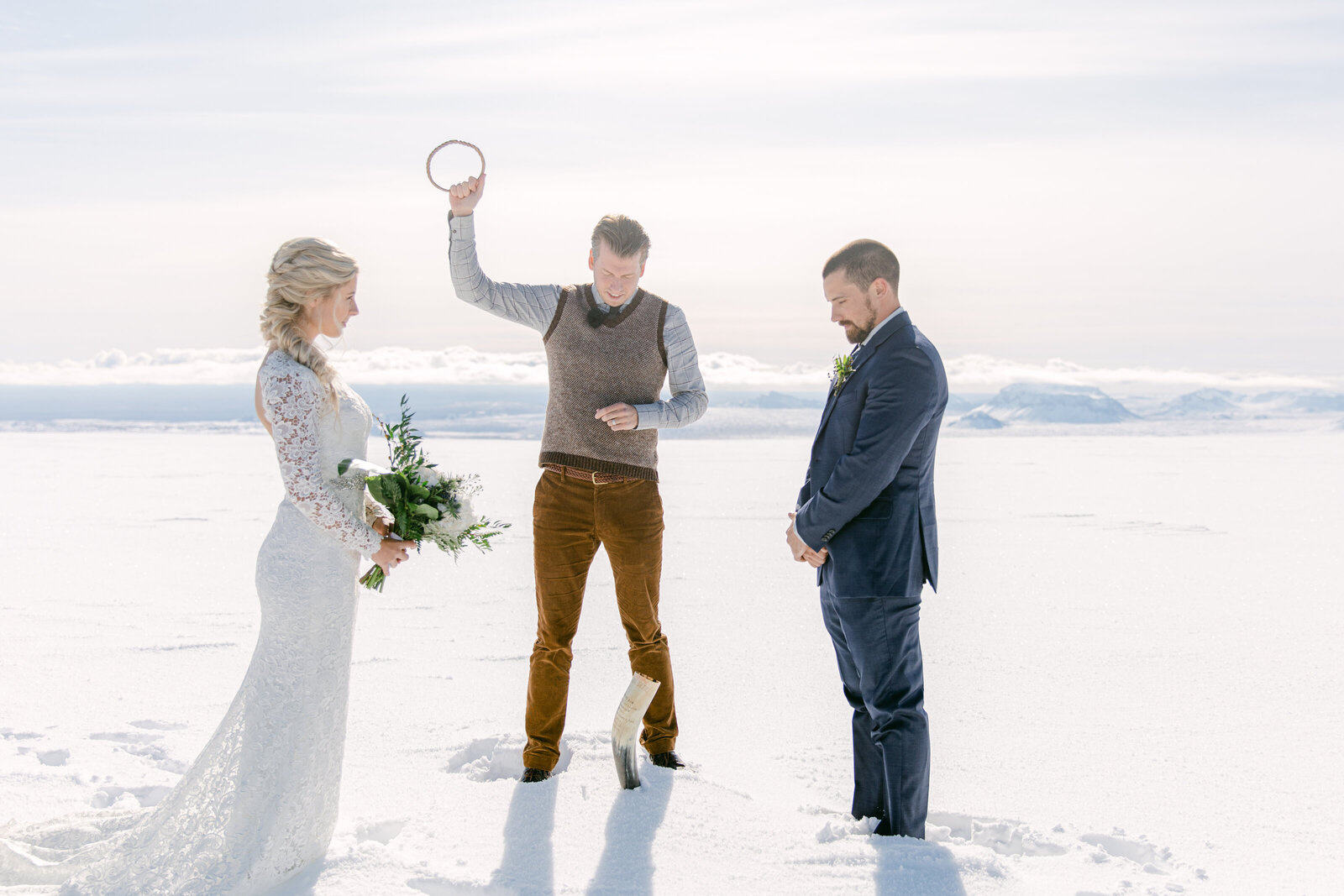 iceland officiating an elopement on top of a glacier with bride and groom