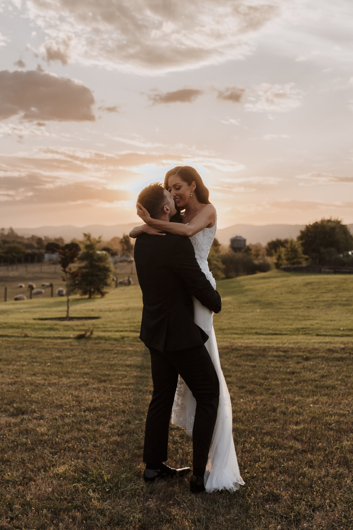 A couple hugging at their wedding at Zonzo Estate Yarra Valley