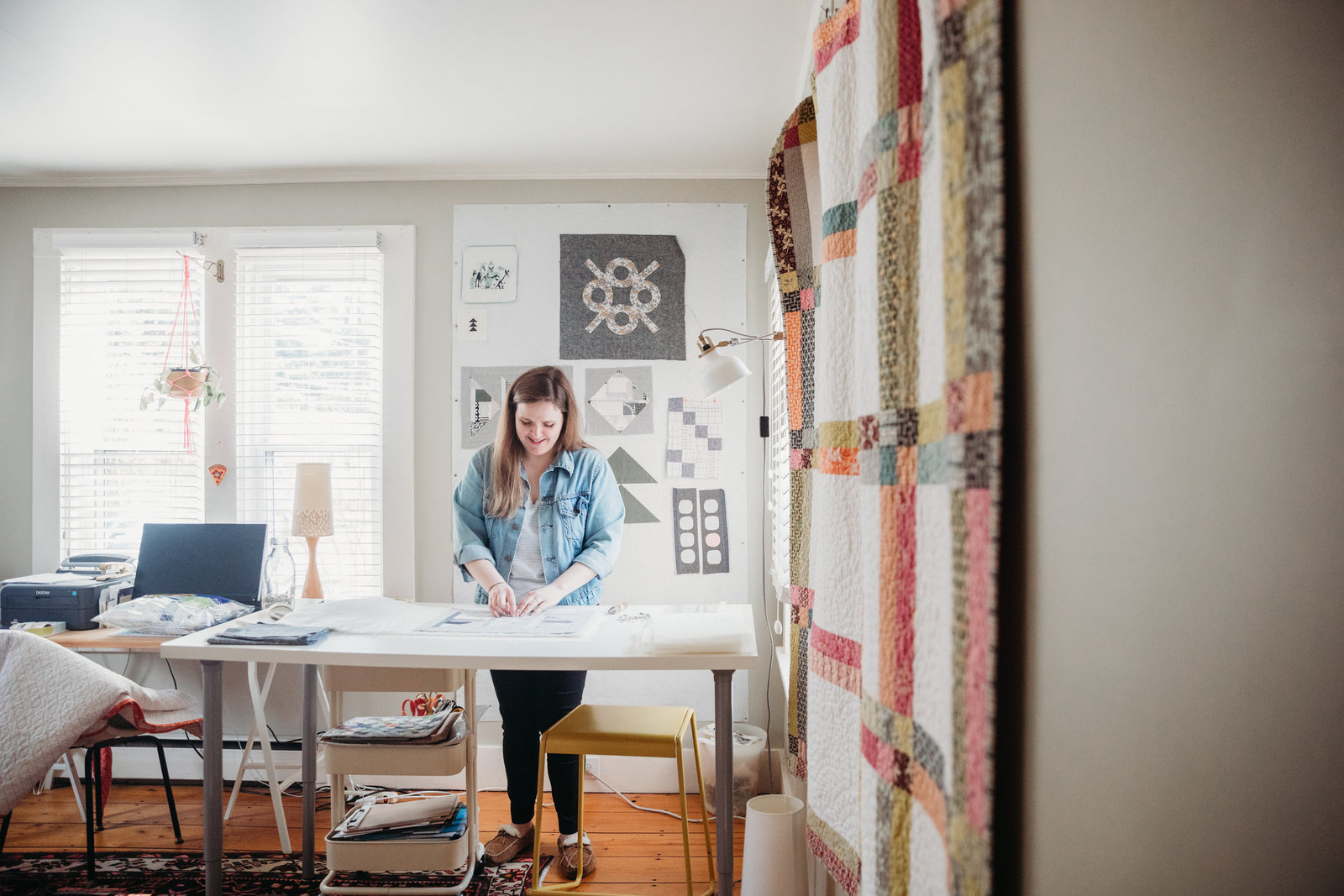 quilter prepares sewing materials in workspace in boston