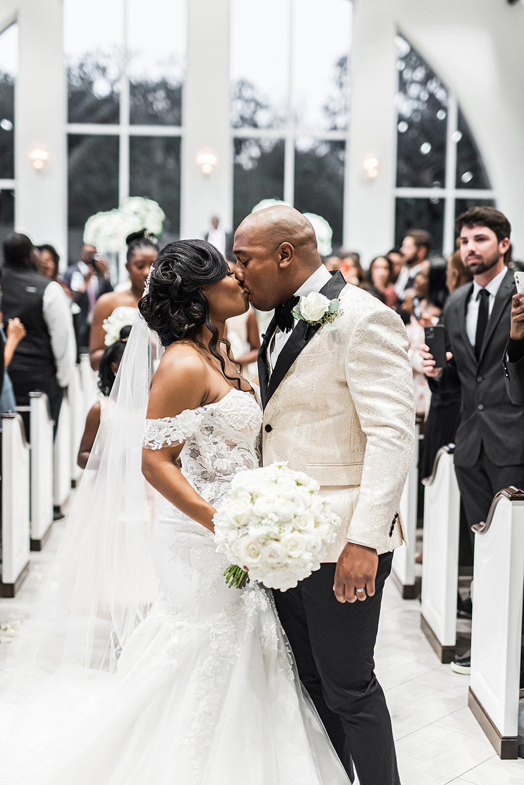 courtney_and_ajalen_wedding_kiss_at_the_bowden_dallas_wedding_planner
