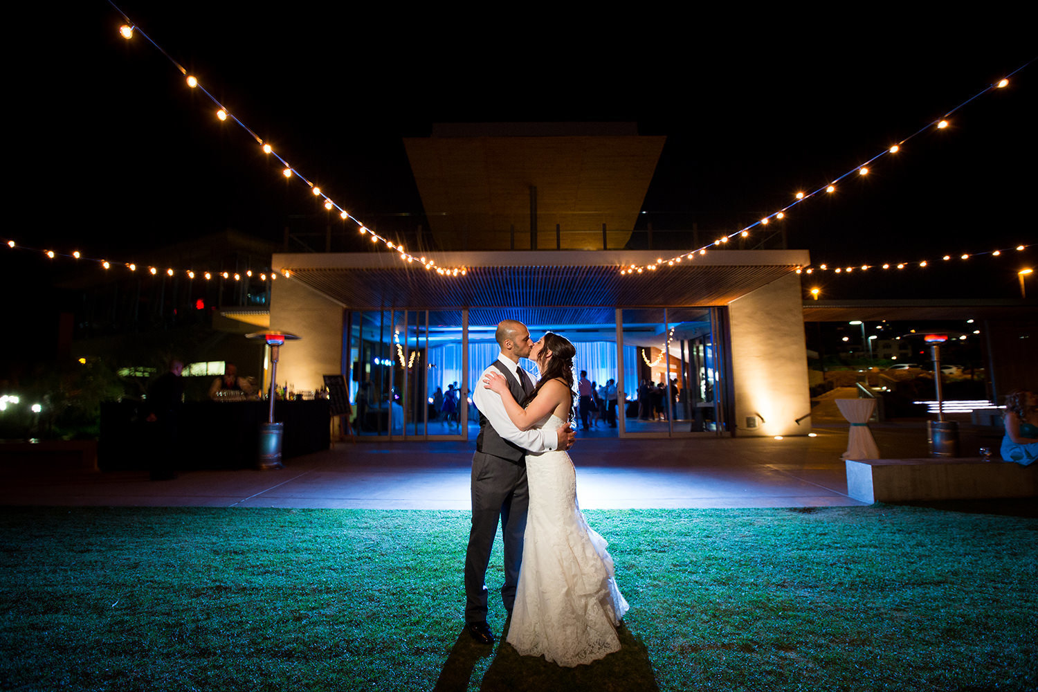 night shot with bride and groom and reception spot