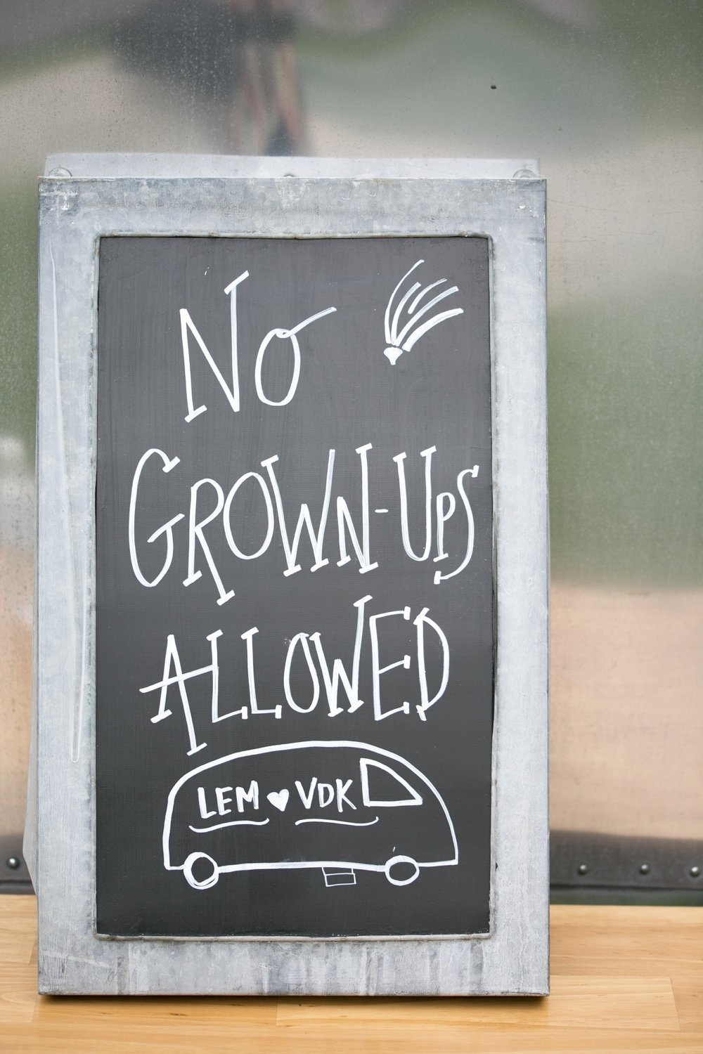 No grownups allowed chalkboard sign at wedding. Great for a kids play area!
