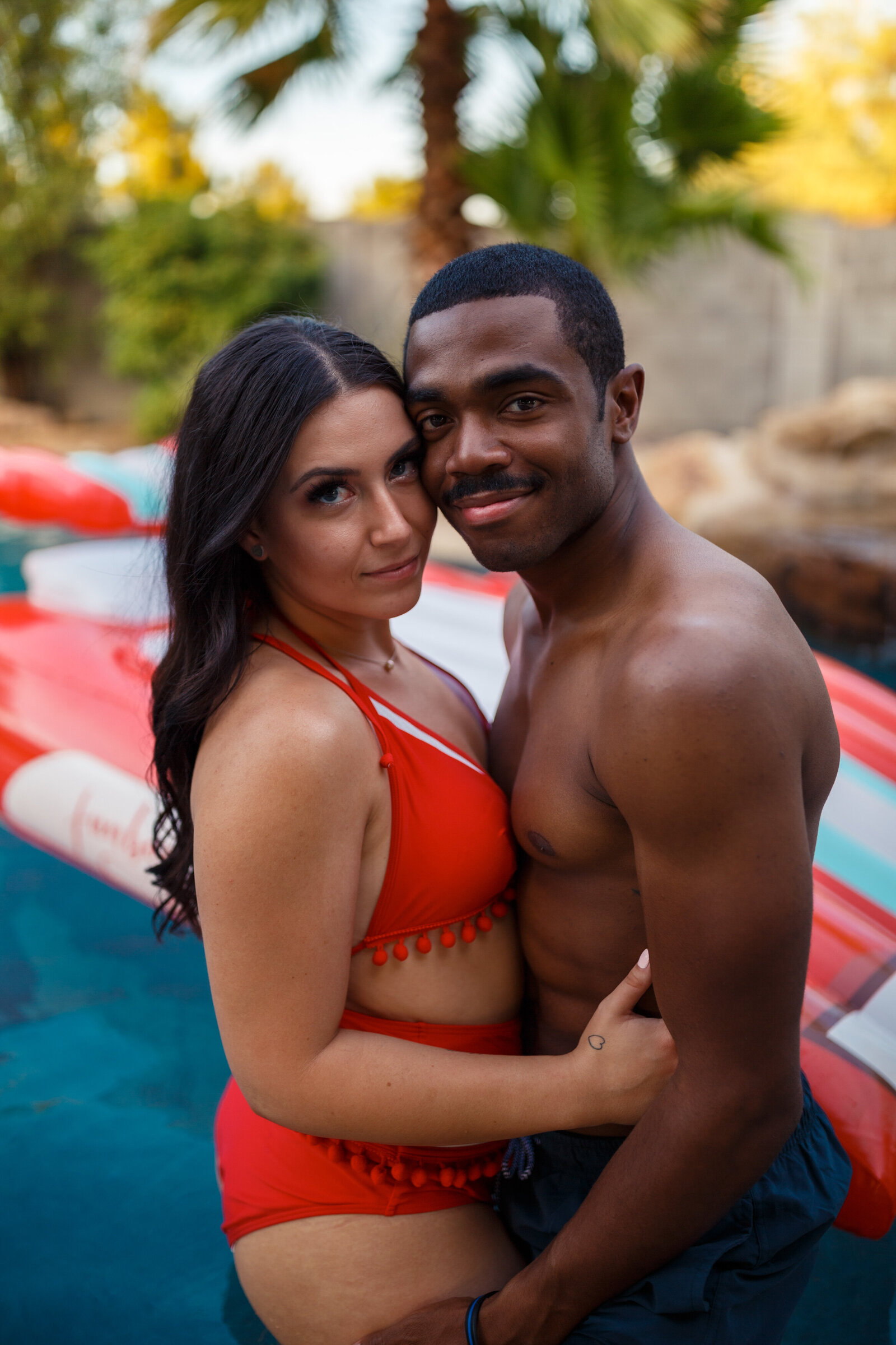 fourth of july themed couples photos in the pool
