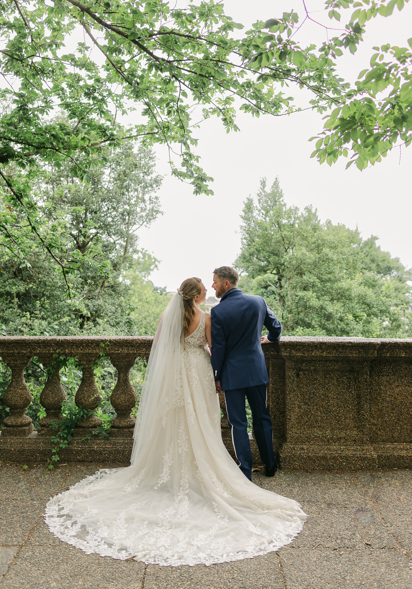 Florida wedding couple overlooking a balcony post-ceremony while gazing lovingly