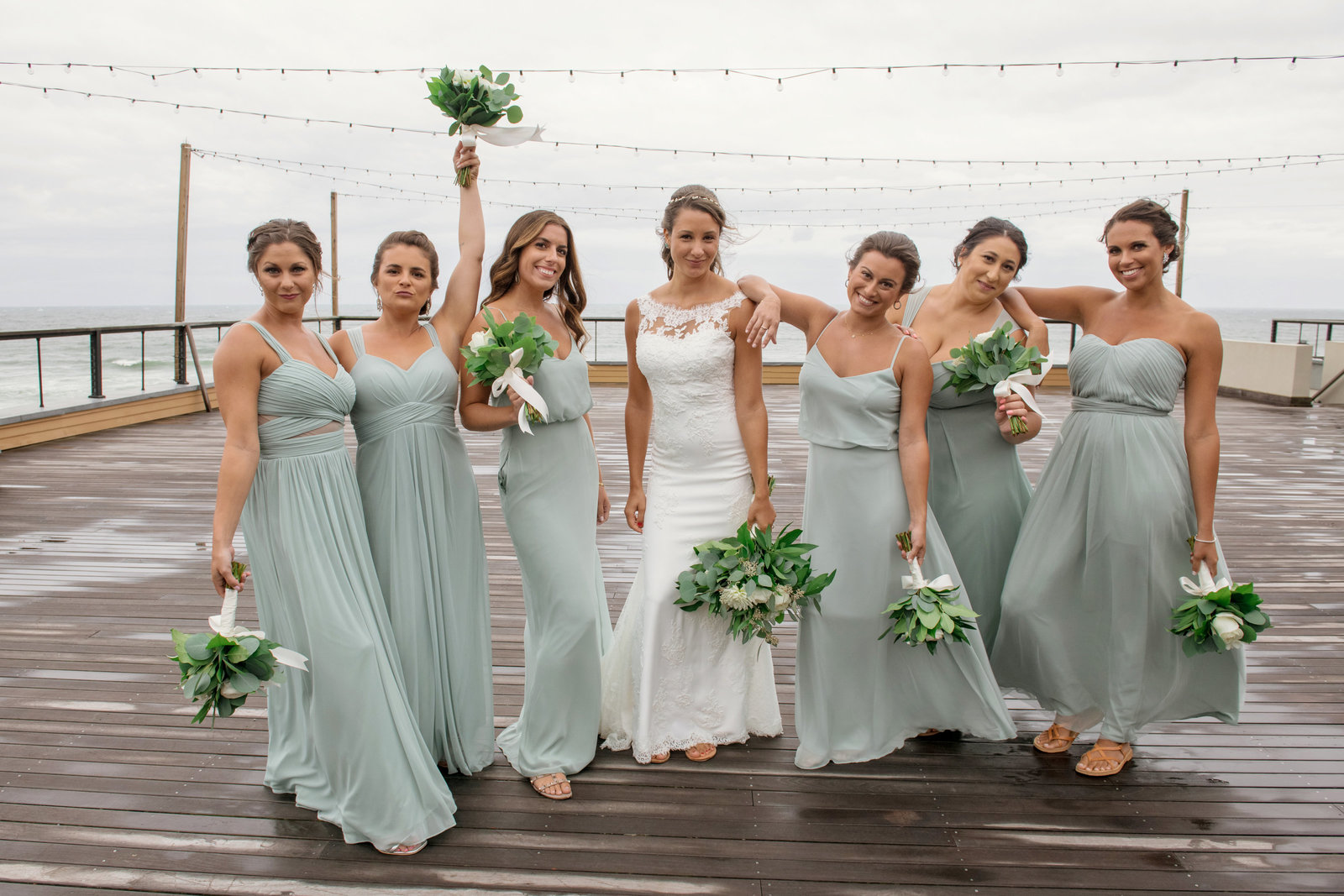 photo of bridesmaids with bride on boardwalk from  Gurneys Montauk Resort wedding