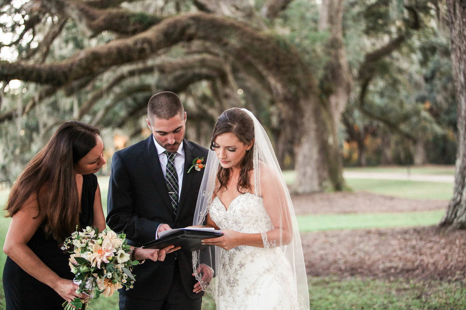 Bride and groom sign marriage license at Avenue of Oaks, Boone Hall Plantation, Charleston, South Carolina