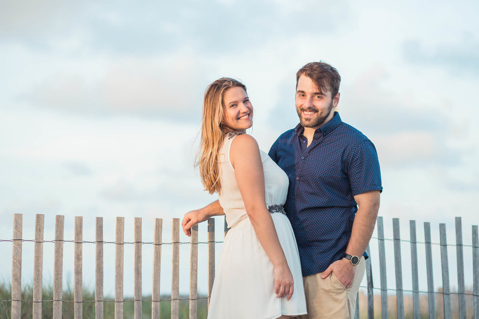 Engaged Couple by the dunes at sunset, Folly beach in Charleston, South Carolina