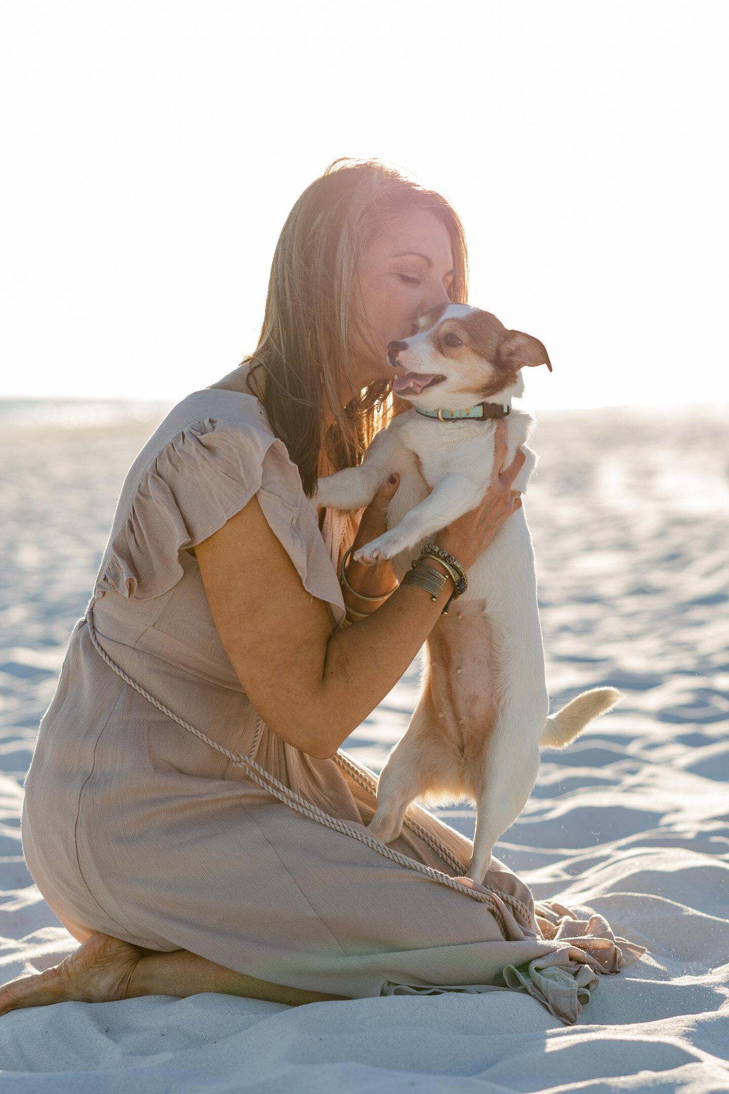 Pensacola Beach Dog Beach Photography. Mother holding dog.
