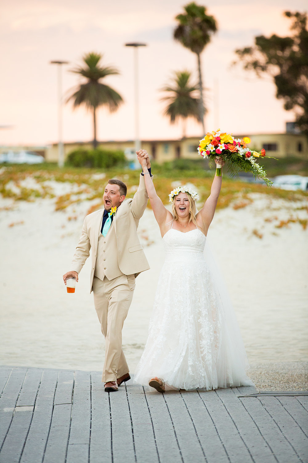 bride and groom walking into their reception at breakers beach